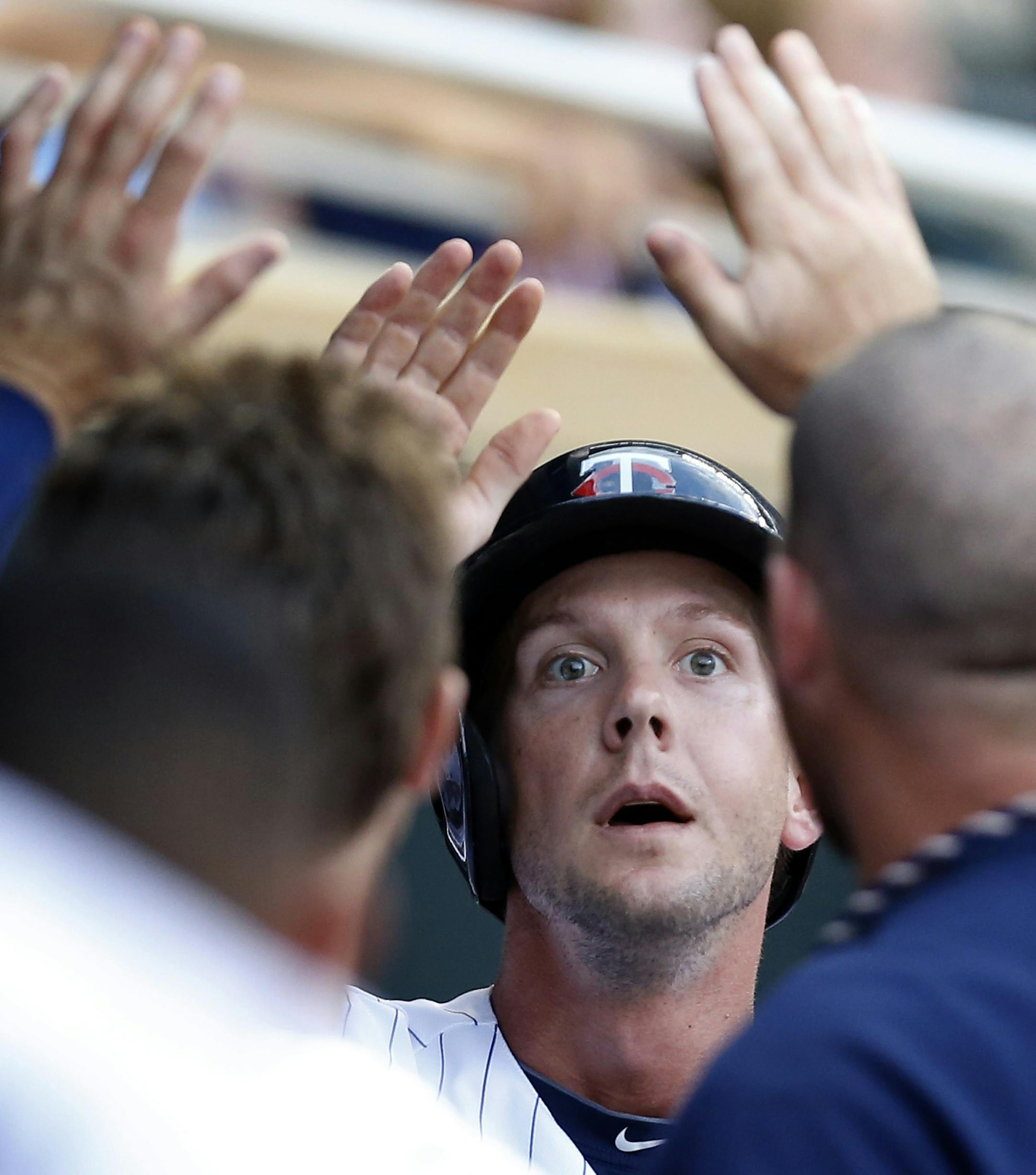 Clete Thomas (11) received high fives from teammates after scoring in the fourth inning. ] CARLOS GONZALEZ cgonzalez@startribune.com June 27, 2013, Minneapolis, Minn., Target Field, MLB, Minnesota Twins vs. Kansas City Royals