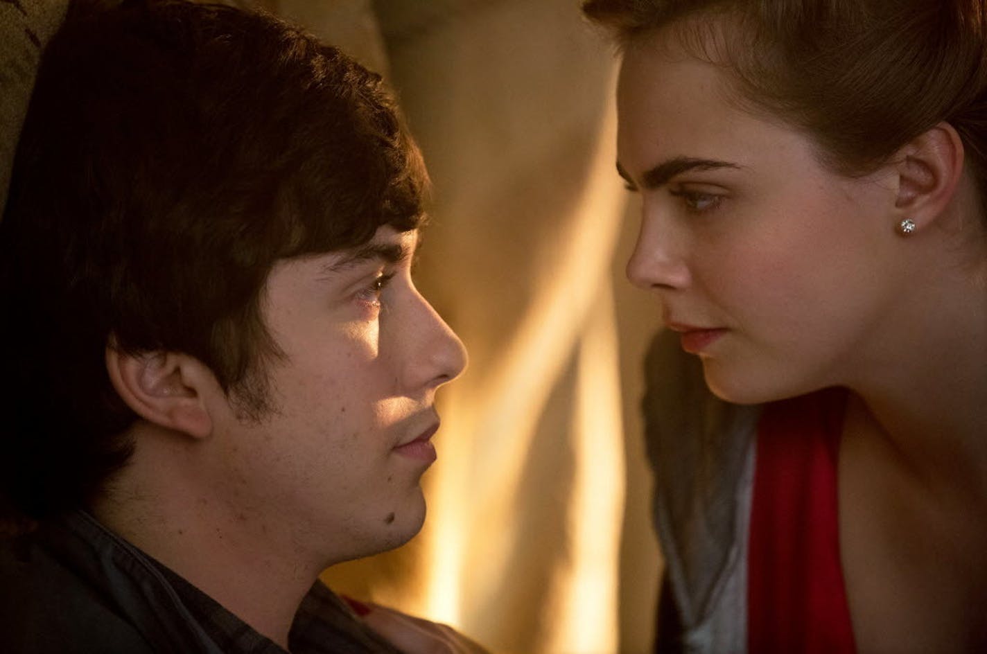 Cara Delevingne, right, as Margo, and Nat Wolff as Quentin, star in "Paper Towns."