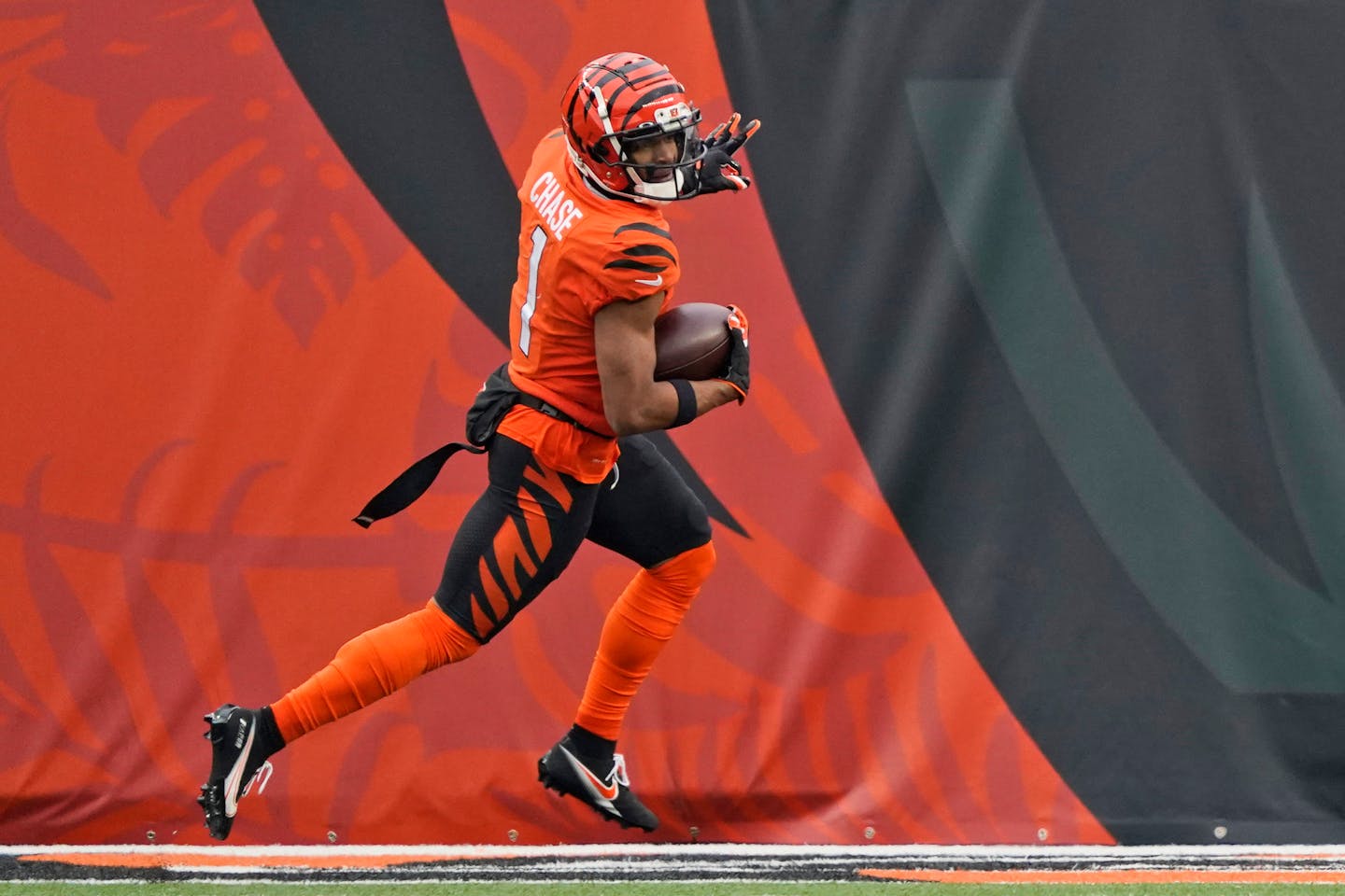 Cincinnati Bengals wide receiver Ja'Marr Chase celebrates after scoring a touchdown during the second half of an NFL football game against the Kansas City Chiefs, Sunday, Jan. 2, 2022, in Cincinnati. (AP Photo/Jeff Dean)