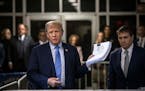 Former President Donald Trump speaks to reporters as he arrives for his criminal trial at Manhattan Criminal Court in Manhattan, on Friday, April 26, 