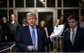 Former President Donald Trump speaks to reporters as he arrives for his criminal trial at Manhattan Criminal Court in Manhattan, on Friday, April 26,