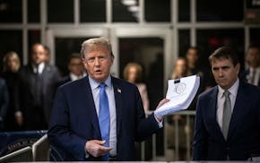 Former President Donald Trump speaks to reporters as he arrives for his criminal trial at Manhattan Criminal Court in Manhattan, on Friday, April 26, 