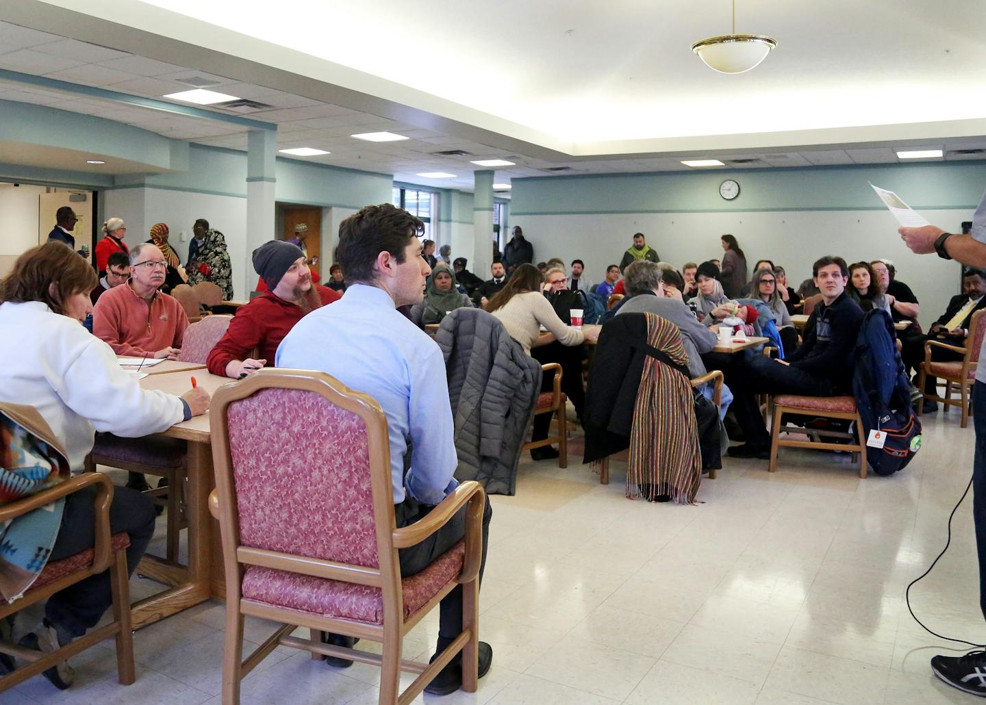 Minneapolis Mayor-Elect Jacob Frey, center, seated, held a community listening session Friday at the Horn Towers public housing complex in Minneapolis.