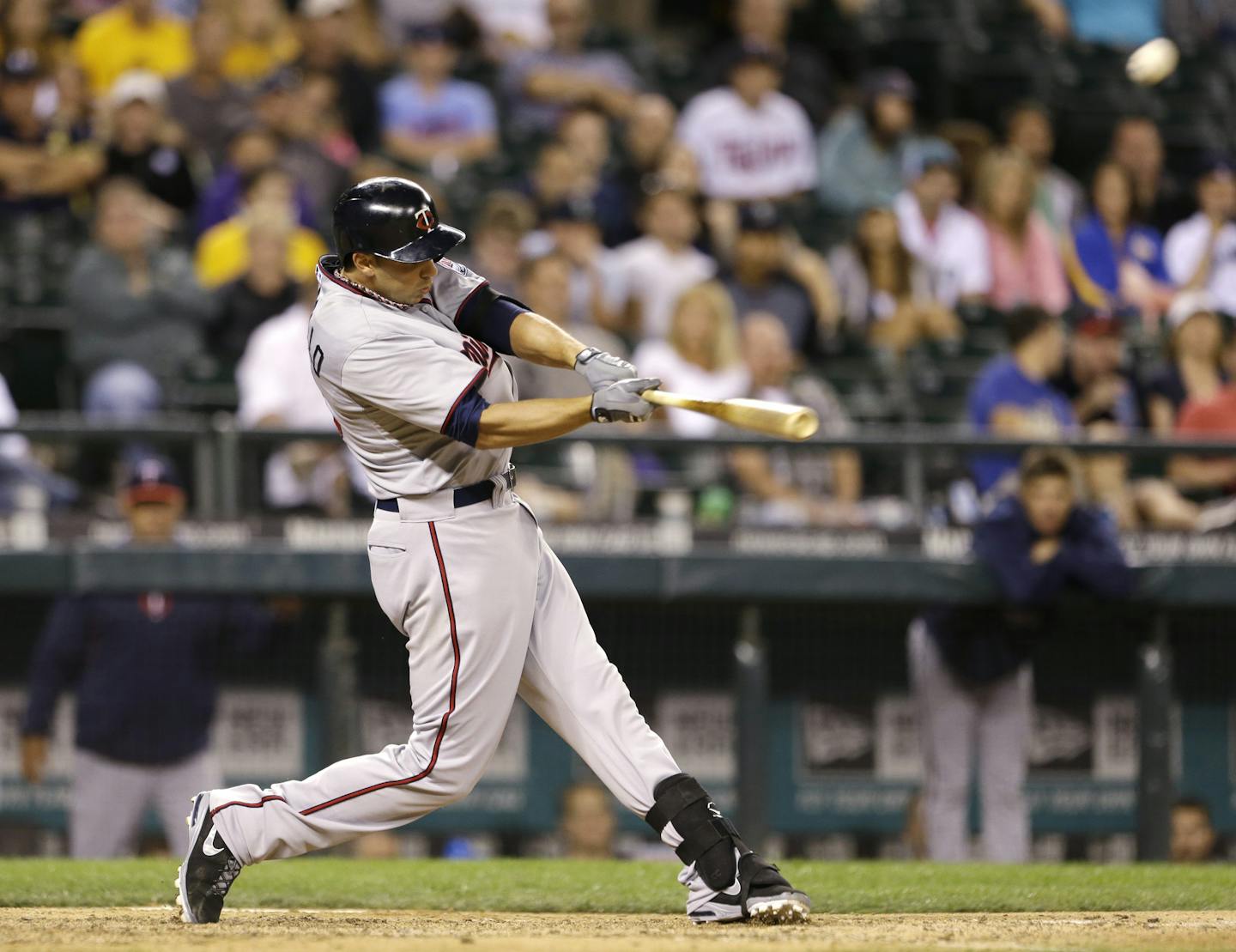 Minnesota Twins' Chris Colabello hits a two-run home run against the Seattle Mariners in the 13th inning of a baseball game Friday, July 26, 2013, in Seattle. (AP Photo/Elaine Thompson)