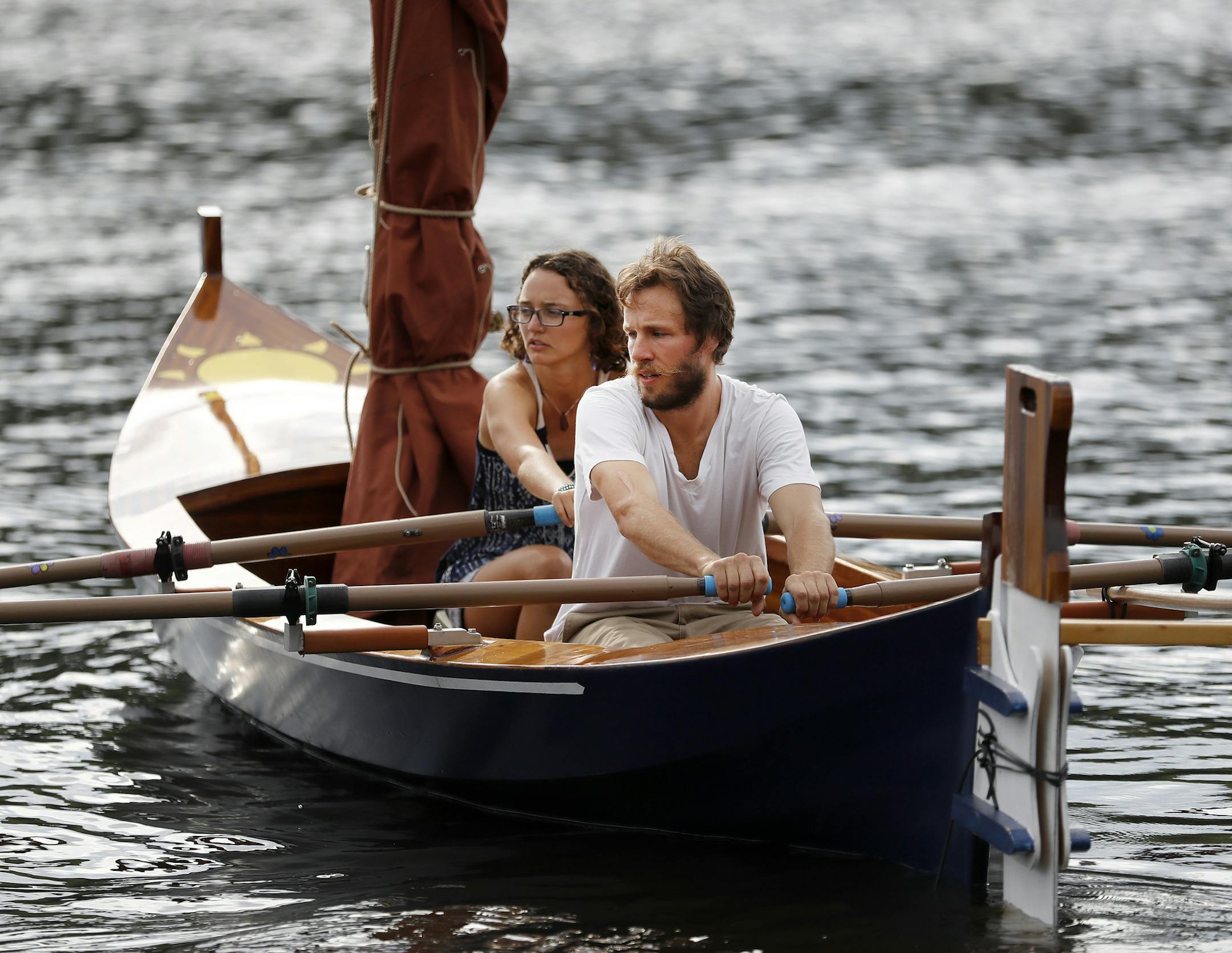 Kyle Hawkins and Danielle Kreusch in the Solvi. The couple built the boat themselves which took an estimated 1,600 hours to build. ] CARLOS GONZALEZ cgonzalez@startribune.com - August 10, 2016, St. Croix Falls, WI, Young couple builds its own boat in preparation for sailing down the Mississippi. Kyle Hawkins and Danielle Kreusch