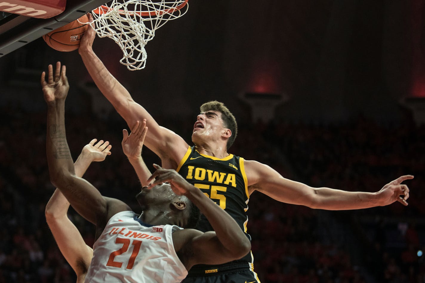 Iowa's Luka Garza blocked the shot of Illinois' Kofi Cockburn in March. Both players are back in school this fall and among the best in the nation.