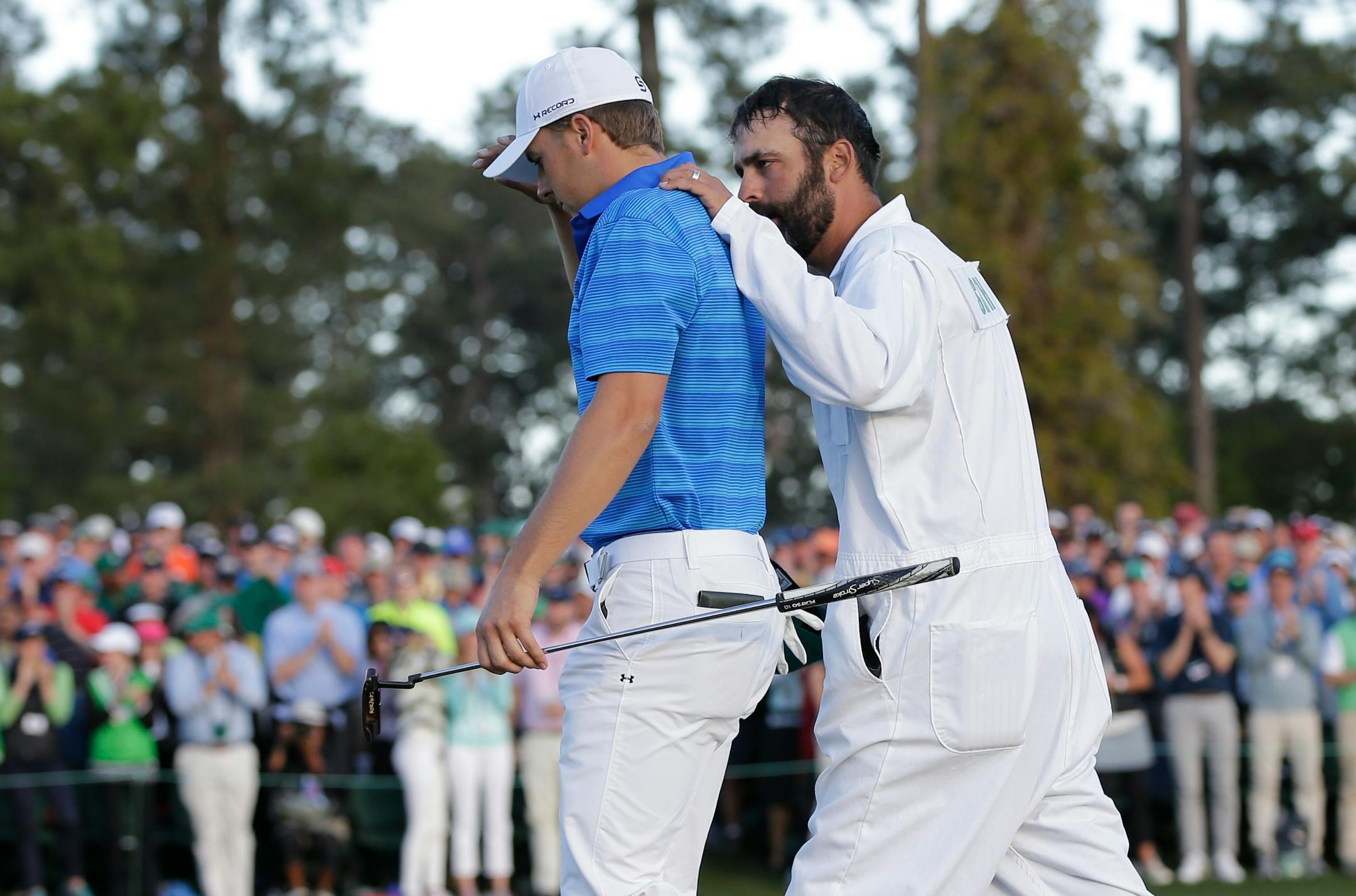 Caddie Michael Greller consoled Jordan Spieth on the 18th hole after the final round of the Masters.