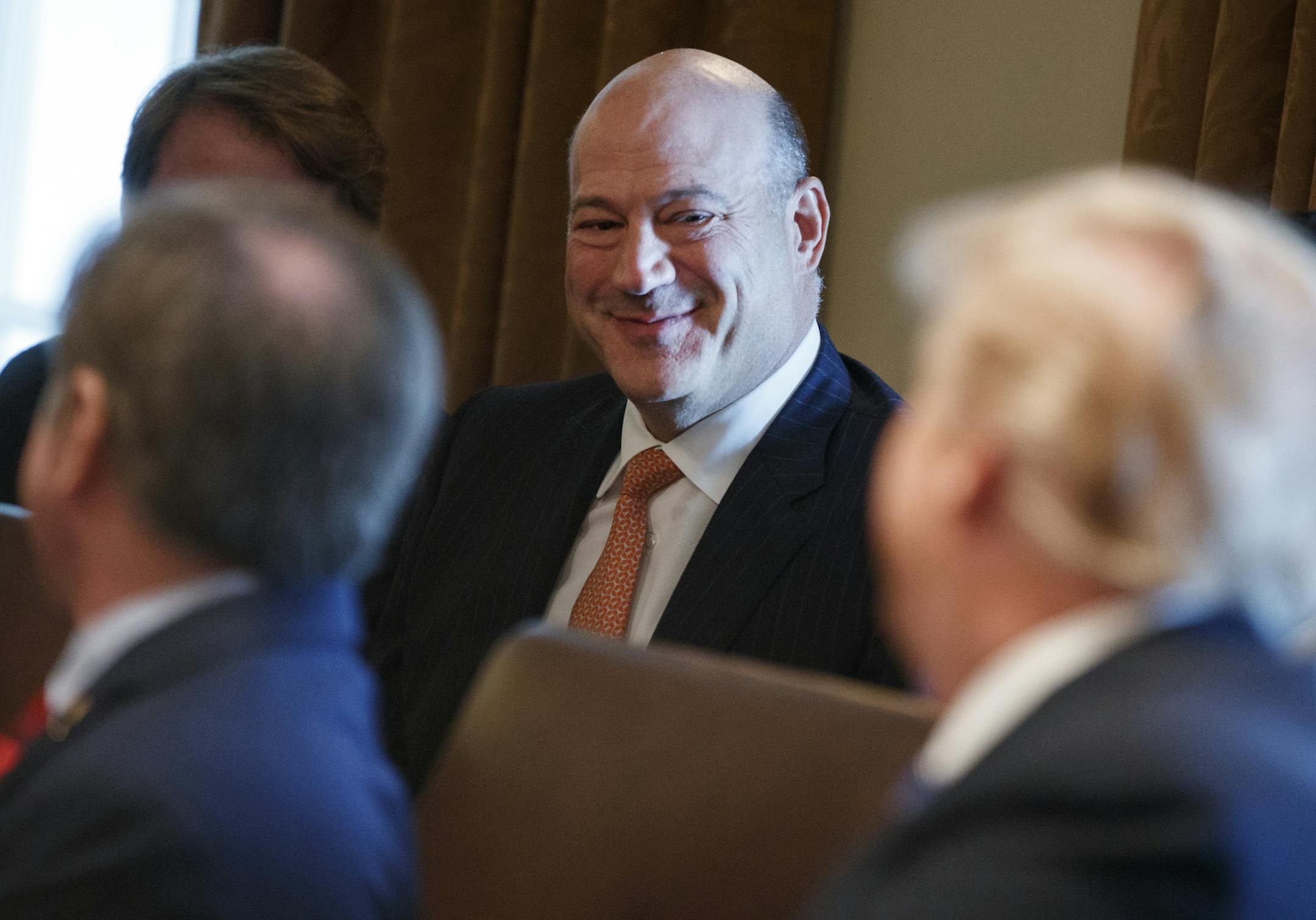 President Donald Trump speaks to outgoing White House chief economic adviser Gary Cohn during a cabinet meeting at the White House, Thursday, March 8, 2018, in Washington. (AP Photo/Evan Vucci)