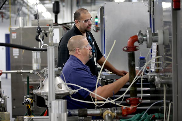Workers test filtration equipment at Donaldson's plant in Bloomington in this file photo. (ELIZABETH FLORES/STAR TRIBUNE)