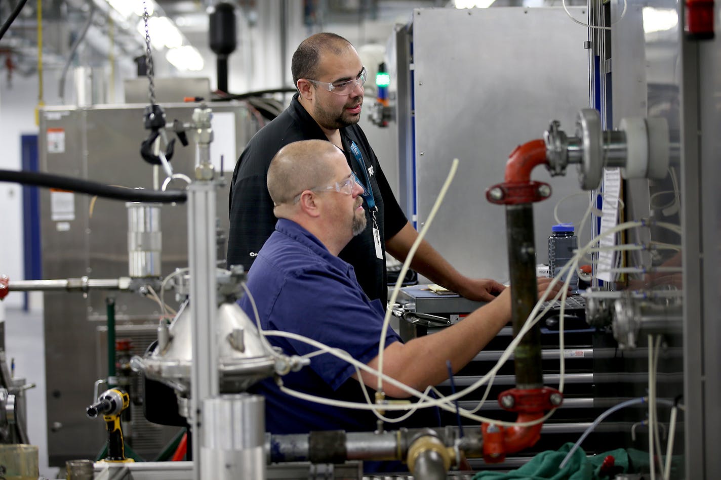 Workers test filtration equipment at Donaldson's plant in Bloomington in this file photo. (ELIZABETH FLORES/STAR TRIBUNE)