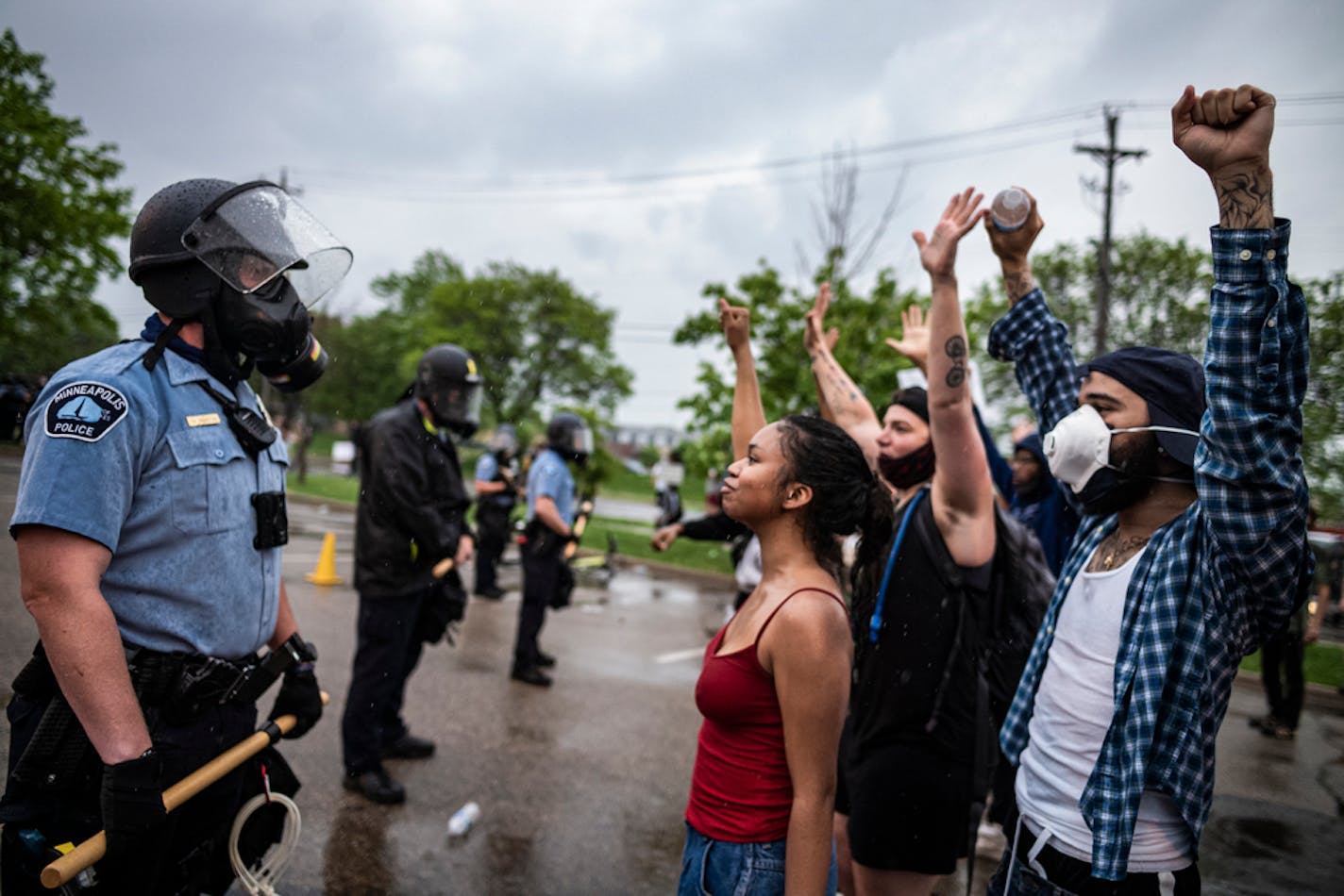 Minneapolis police officers faced off with protesters outside the Third Precinct station on May 26. Morale has plummeted in the department since the Floyd protests and at least seven officers have resigned.