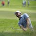 Lucas Glover hit out of the rough on the18th hole during the final day of the 3M Open at TPC Twin Cities.