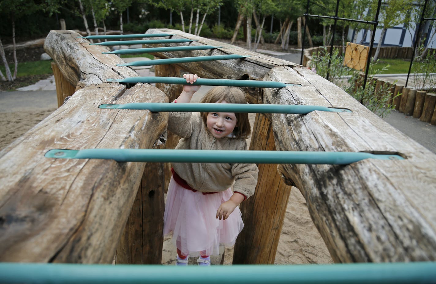 Maren Vegoe pushed herself to conquer the monkey bars, despite the fact the rungs were wet from rain. The outdoor play area at the Child Development Center features elements found in nature. ] Shari L. Gross &#x2022; shari.gross@startribune.com Just days after the University of Minnesota announced it would scrap plans to close its child care center after an outcry from parents, families are rallying to oppose a plan to close the Child Development Center. The university wants to open a new studen