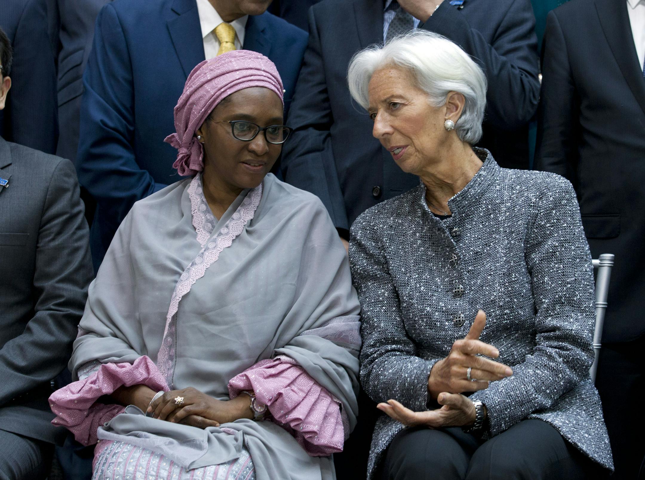 International Monetary Fund (IMF) Managing Director Christine Lagarde speaks with Nigeria's Finance Minister Zainab Ahmed, during the International Monetary Fund IMF Governors group photo at the World Bank/IMF Spring Meetings in Washington, Saturday, April 13, 2019. (AP Photo/Jose Luis Magana) ORG XMIT: DCJL106