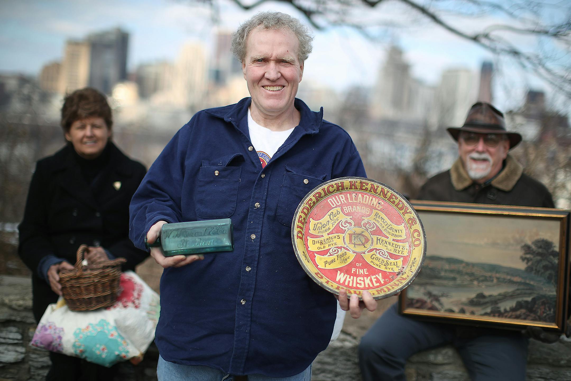 Mark Youngblood, center, the founder of the Old St. Paul Facebook page and Jean Day, left, and Jim Sazevich, right, shared some of their favorite memories on a historic wall that overlooks the city, Wednesday, February 1, 2017 in St. Paul.