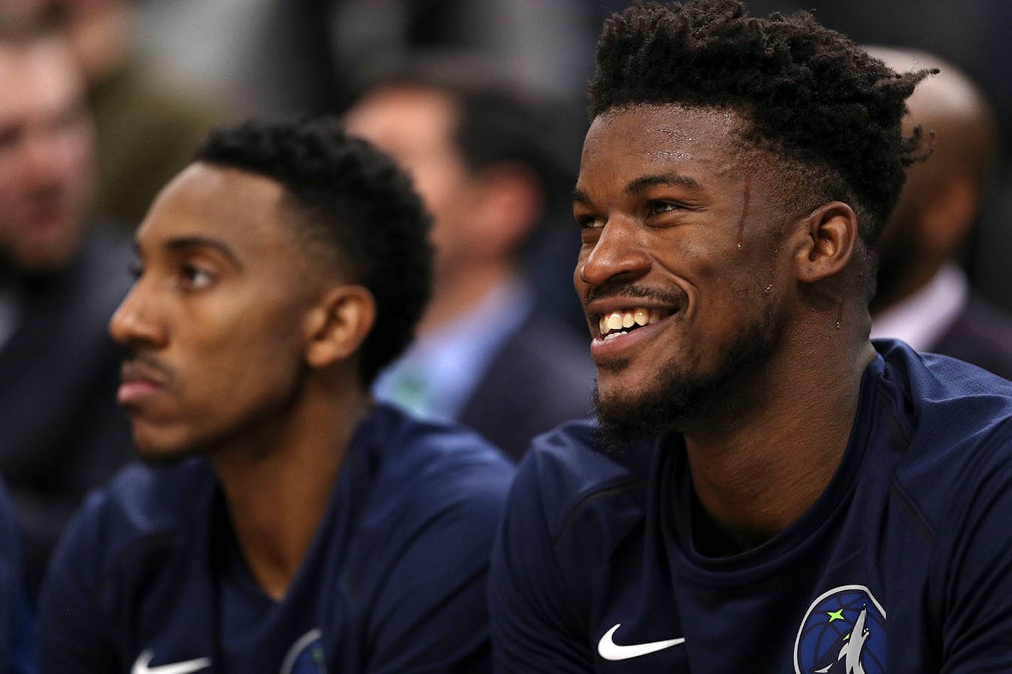 Minnesota Timberwolves forward Jimmy Butler (23) laughed from the bench in the first half.