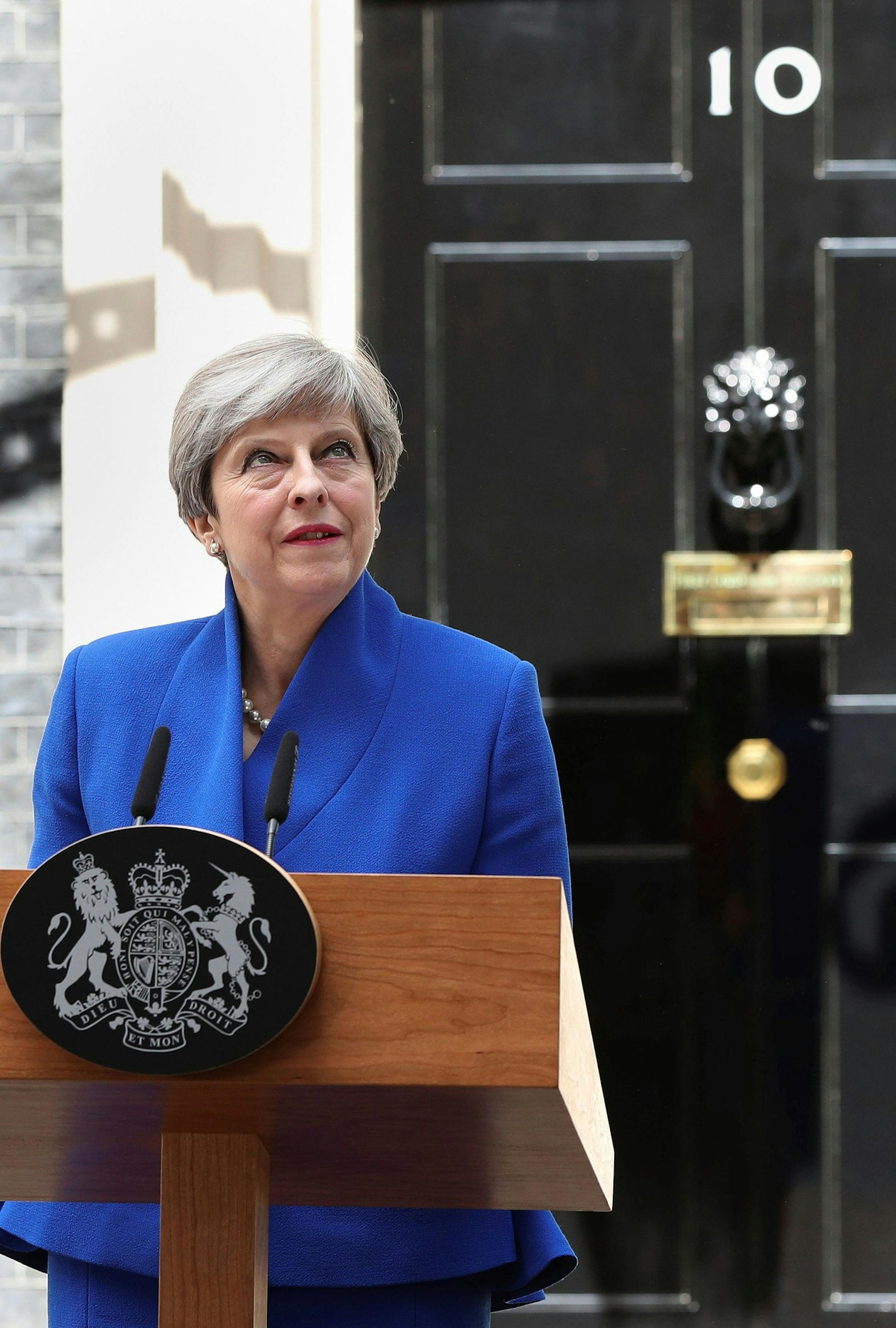 Britain's Prime Minister Theresa May speaks to the media outside 10 Downing Street in London, Friday, June 9, 2017. Prime Minister Theresa May's gamble in calling an early election backfired spectacularly as her Conservative Party lost its majority in Parliament, throwing British politics into chaos.(Jonathan Brady/PA via AP) ORG XMIT: LON828