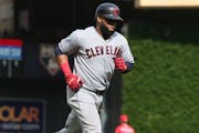 Cleveland Indians' Carlos Santana jogs home on a grand slam against the Minnesota Twins in a baseball game Sunday, Aug. 11, 2019, in Minneapolis. (AP 