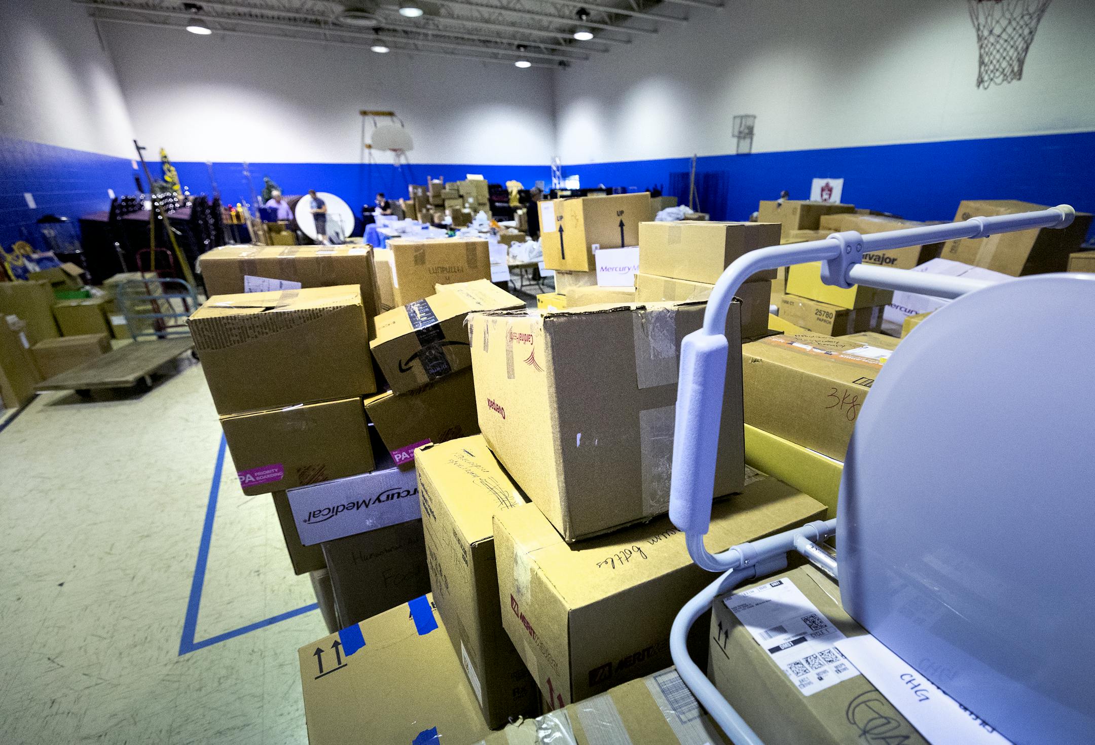 Stacked and sorted boxes of medical supplies at Ukrainian American Community Center.