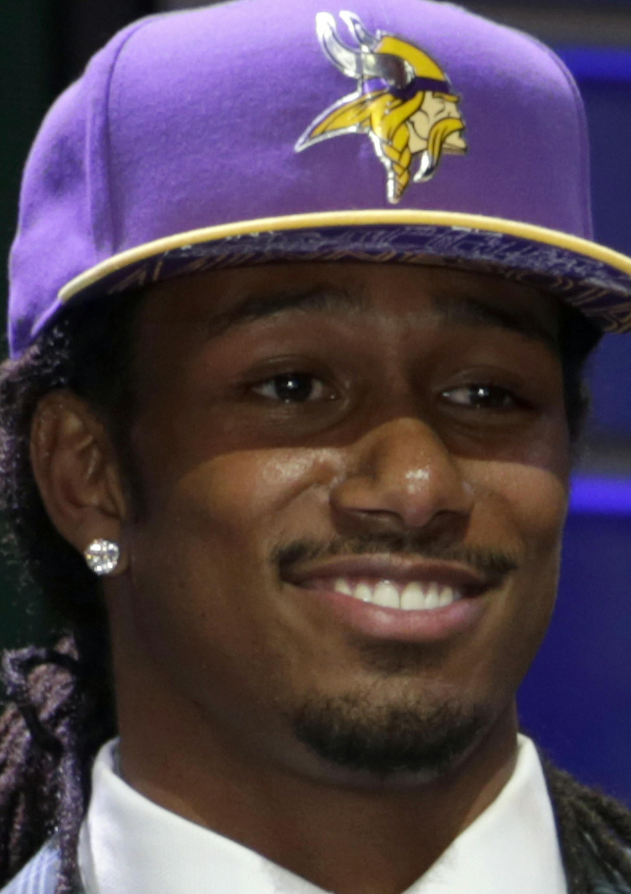 Trae Waynes stands on stage after being drafted 11th by the Minnesota Vikings in the first round of the 2015 NFL Draft, Thursday, April 30, 2015, in Chicago. (Jeff Haynes/AP Images for Panini)