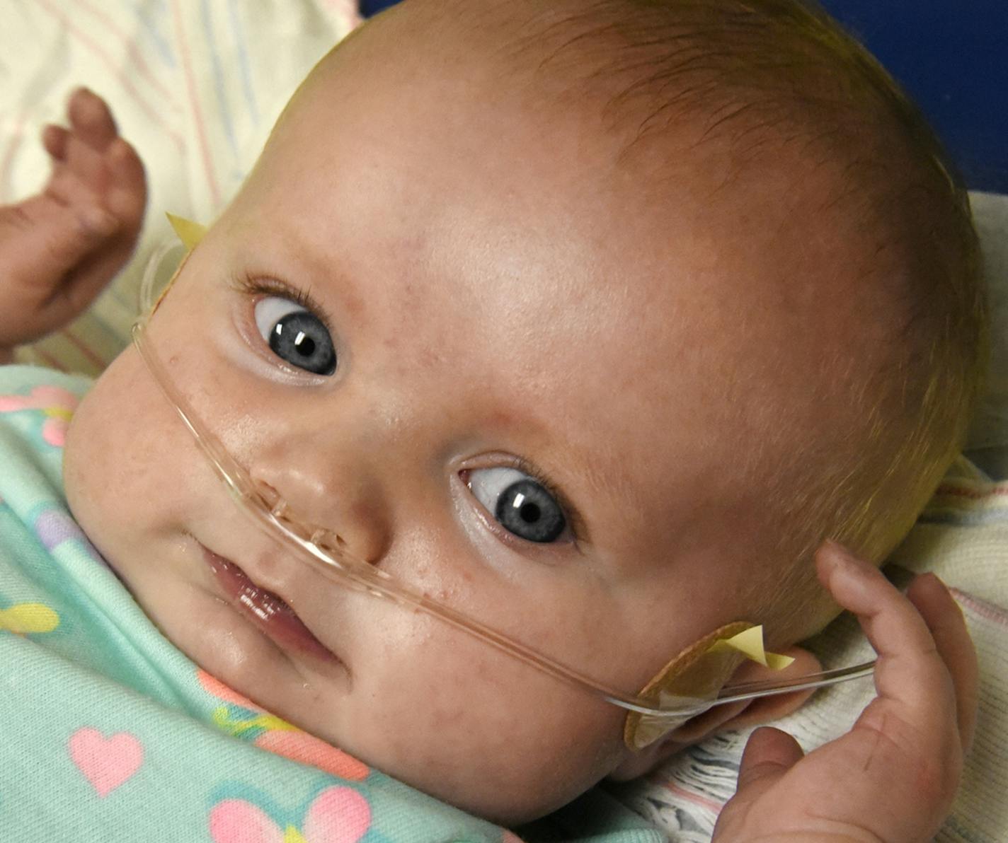 Parents LeeAnn Janes and Wayne Brown of Hagerstown bring their 4-month-old daughter, Autumn Brown, to University of Maryland Medical Center for pre-surgery examination the day before the baby girl undergoes open heart surgery.