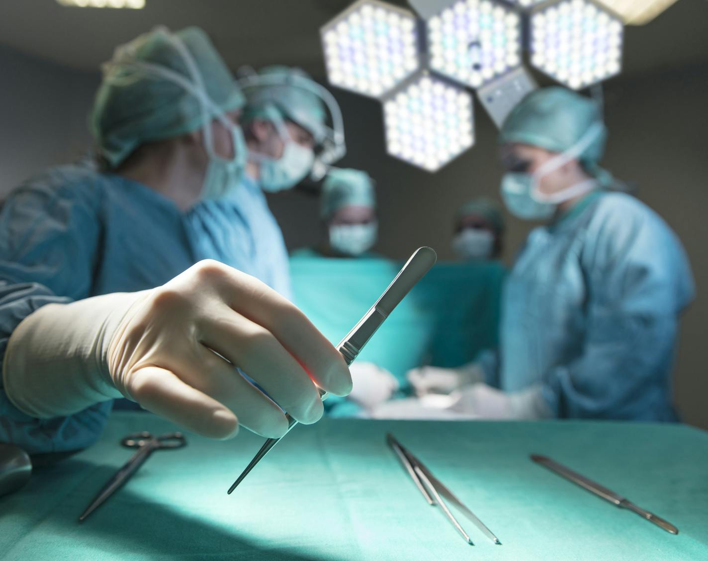 Surgeons in full surgical gear during operation