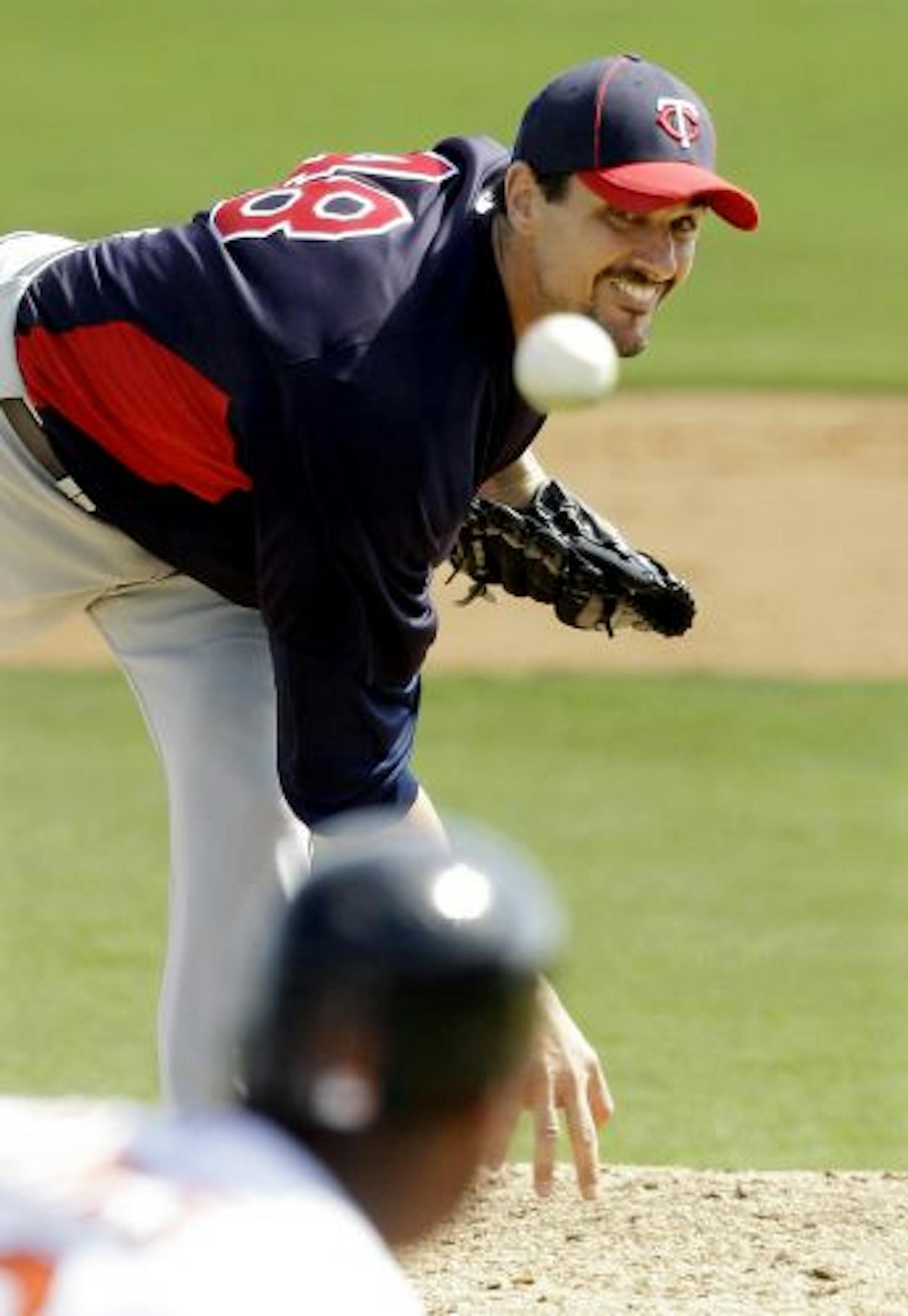 Twins starter Carl Pavano delivered a pitch to the Orioles' Vladimir Guerrero during the second inning Thursday.