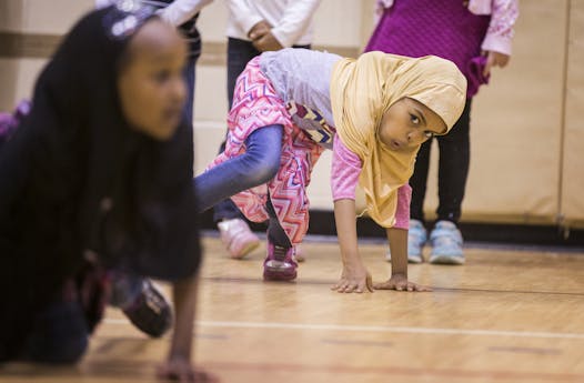 First grader Hayat Ahmad struck a pose during the class led by dancer/teacher Blake Nellis of the Cowles Center for Dance.