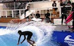 A surfer rides an artificial wave at Citywave Tokyo. MUST CREDIT: The Japan News/Yomiuri