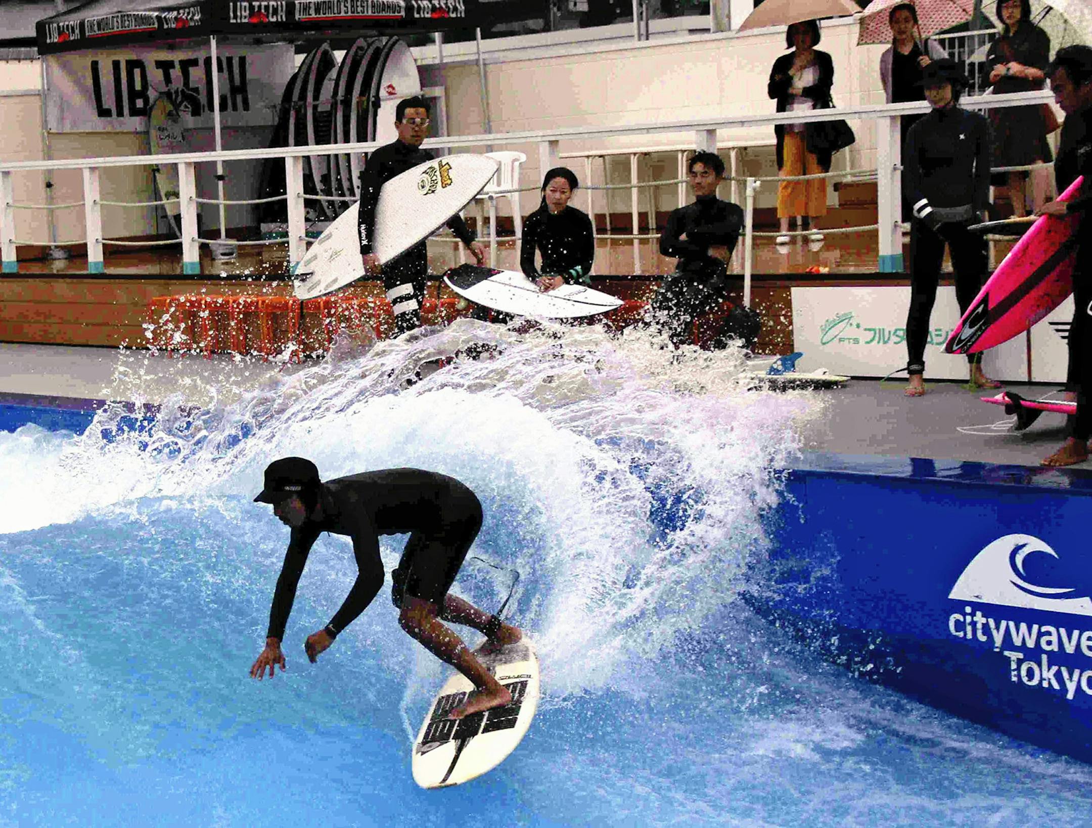 A surfer rides an artificial wave at Citywave Tokyo. MUST CREDIT: The Japan News/Yomiuri
