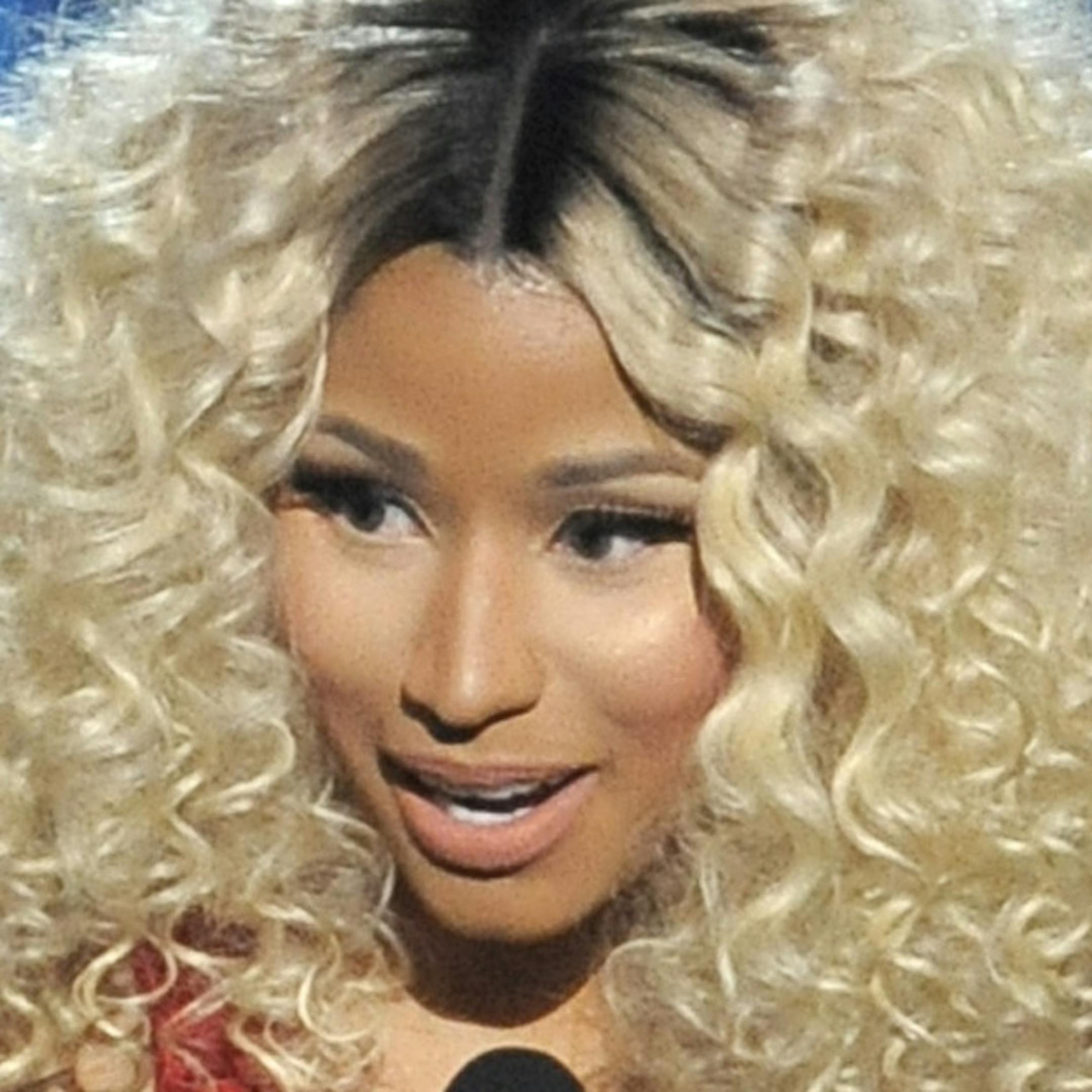 Nicki Minaj accepts the award for top rap artist at the Billboard Music Awards at the MGM Grand Garden Arena on Sunday, May 19, 2013 in Las Vegas. (Photo by Chris Pizzello/Invision/AP)