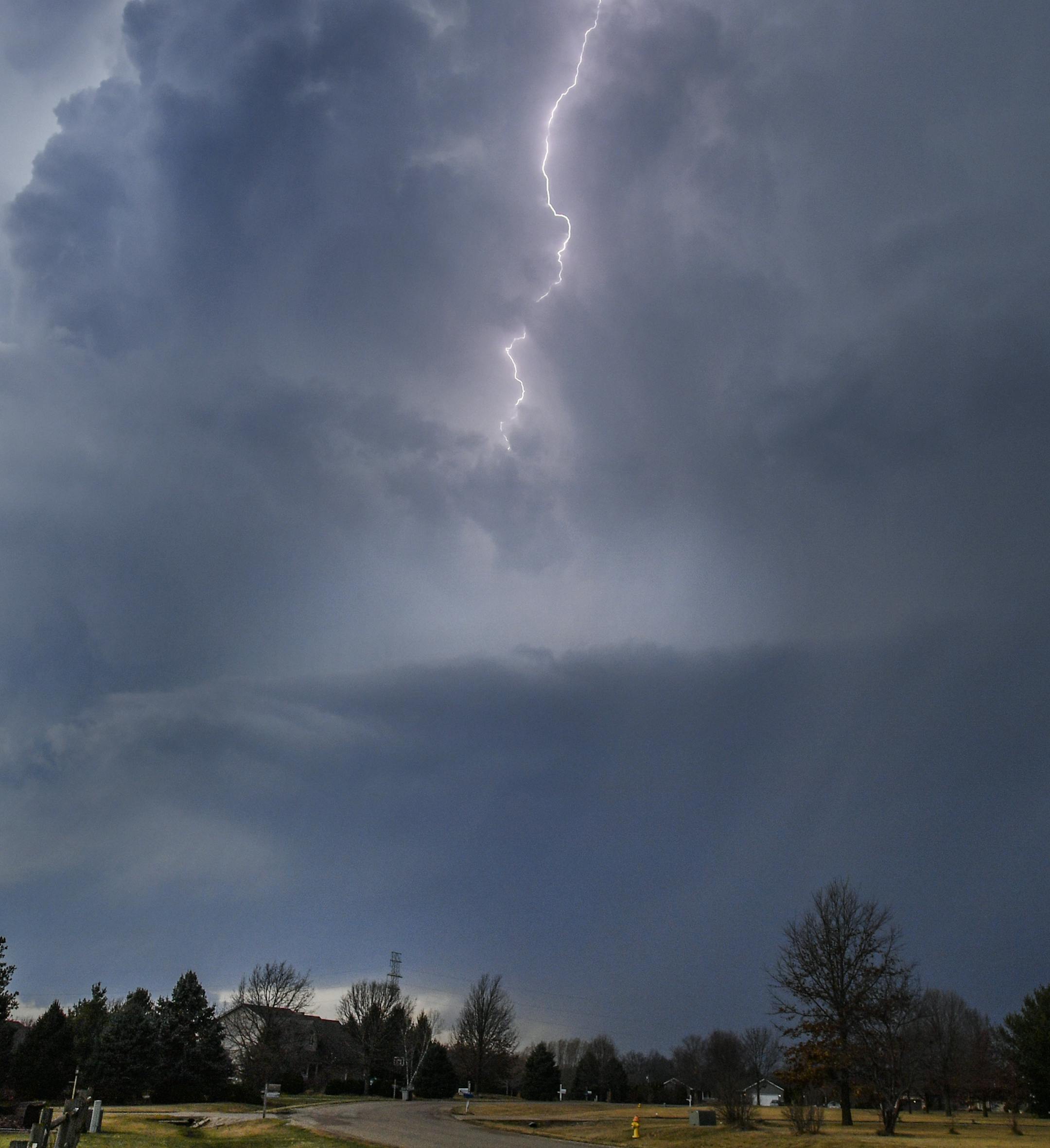 Lightning flashes in storm clouds over the village of Dunlap, Ill., Tuesday, Feb. 28, 2017. A spring-like storm churning across the Midwest poses a risk of more bad weather for millions of people. (Ron Johnson/Journal Star via AP)