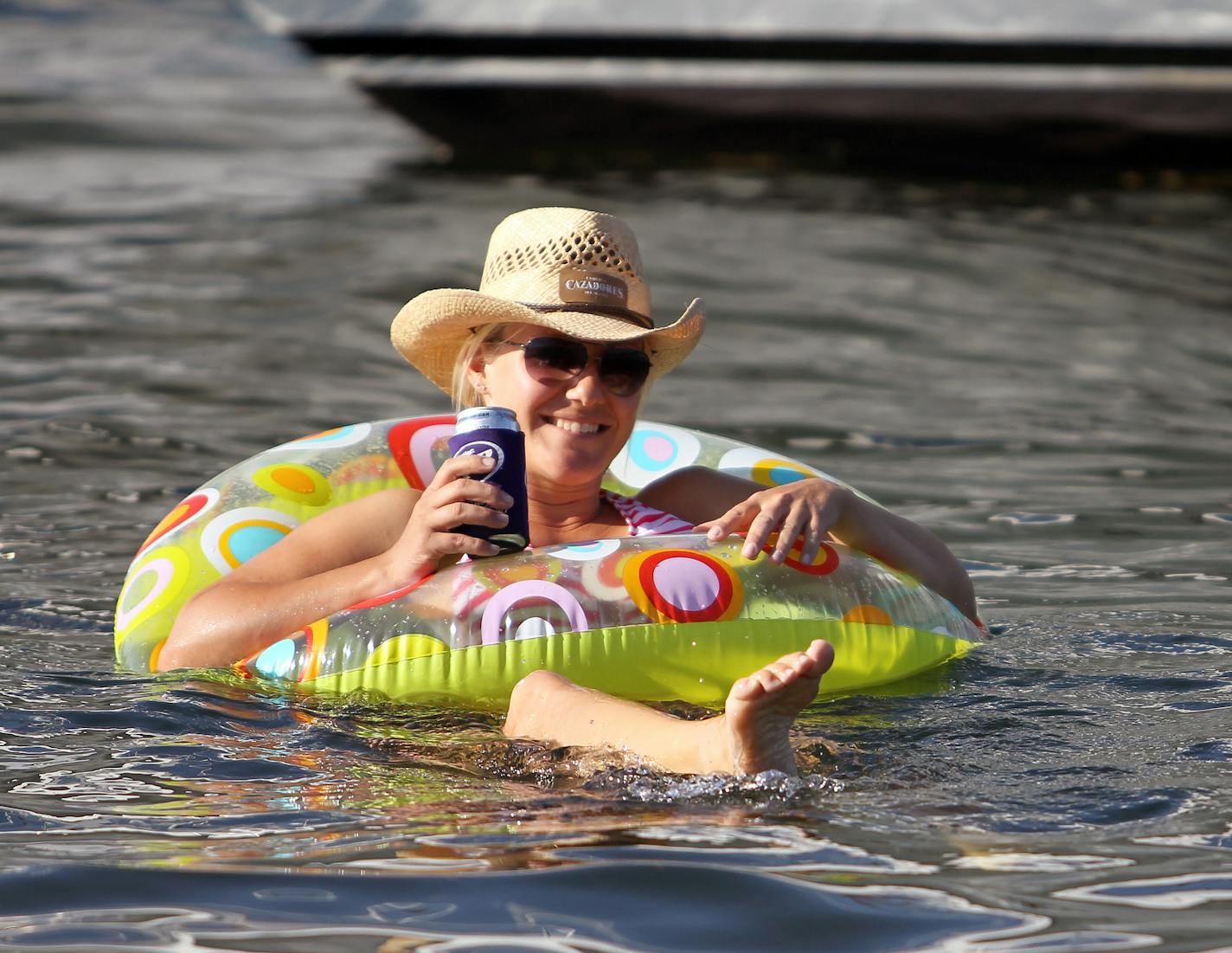 Leah Kinn, of Excelsior, Minn., floats at Cruiser's Cove on Lake Minnetonka near Orono, Minn., on Friday, August 16, 2013. ] (ANNA REED/STAR TRIBUNE) anna.reed@startribune.com (cq)