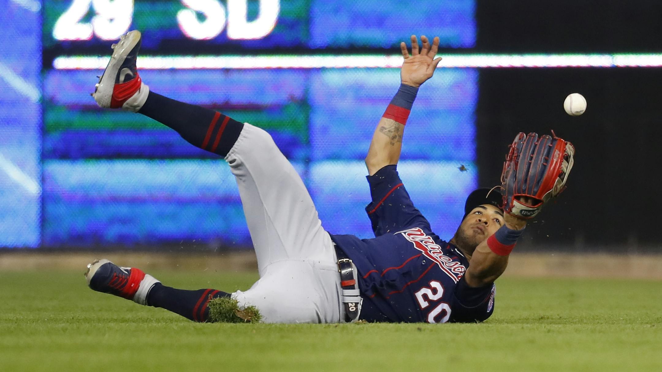 Minnesota Twins left fielder Eddie Rosario (20) catches a Detroit Tigers' Willi Castro fly ball in the eighth inning of a baseball game in Detroit, Wednesday, Sept. 25, 2019.