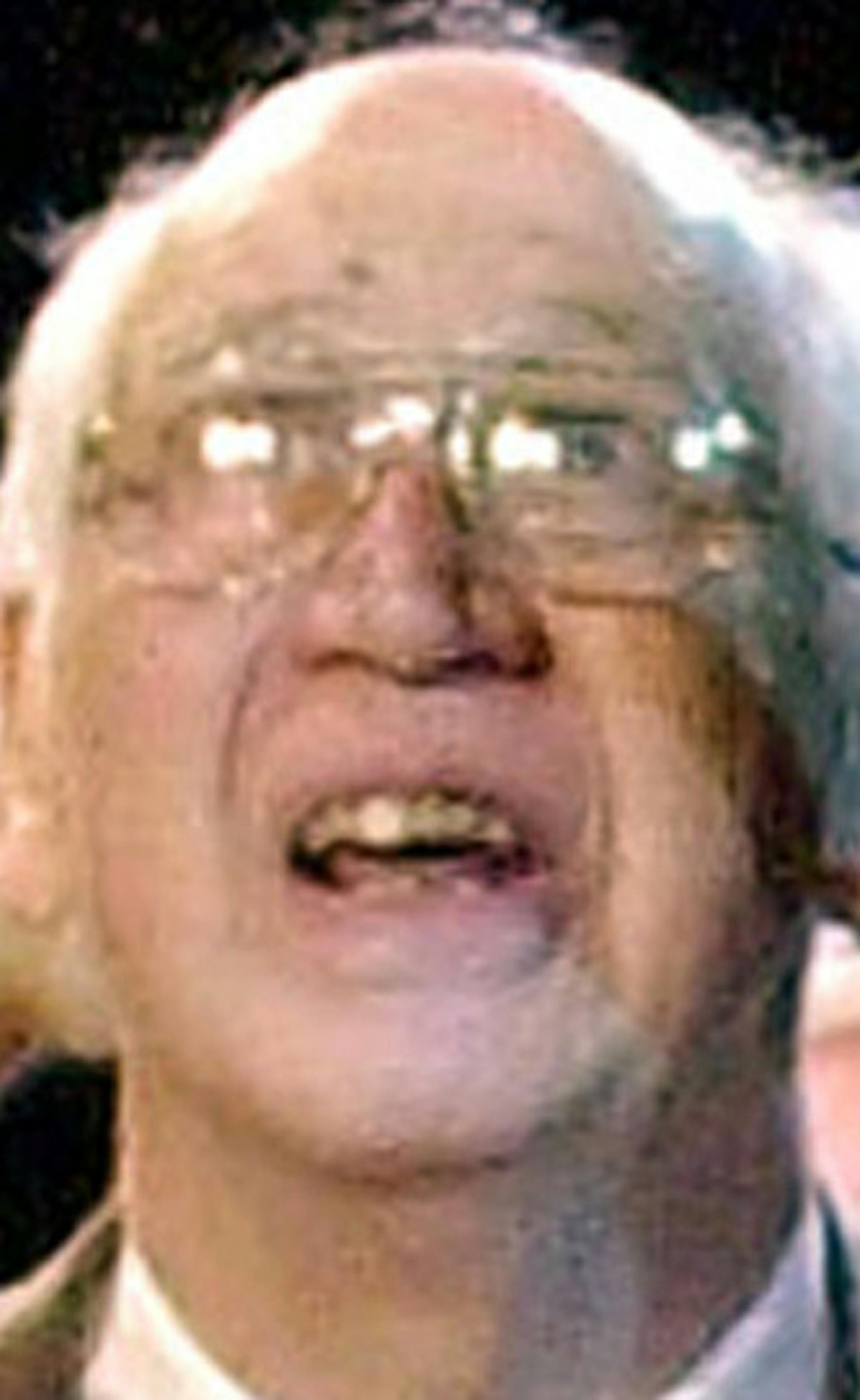 FILE - In this April 11, 2002, file photo, Minneapolis Lakers greats Vern Mikkelsen, left, and George Mikan, lower right, look up at banners honoring the team for winning five NBA titles in six years as former Los Angeles Lakers player James Worthy points during a halftime ceremony at an NBA basketball game in Los Angeles. Mikkelsen, a Hall of Fame basketball player who won four NBA titles with the Lakers, has died. He was 85. The Lakers say Mikkelsen died Thursday, Nov. 21, 2013. (AP Photo/Mark