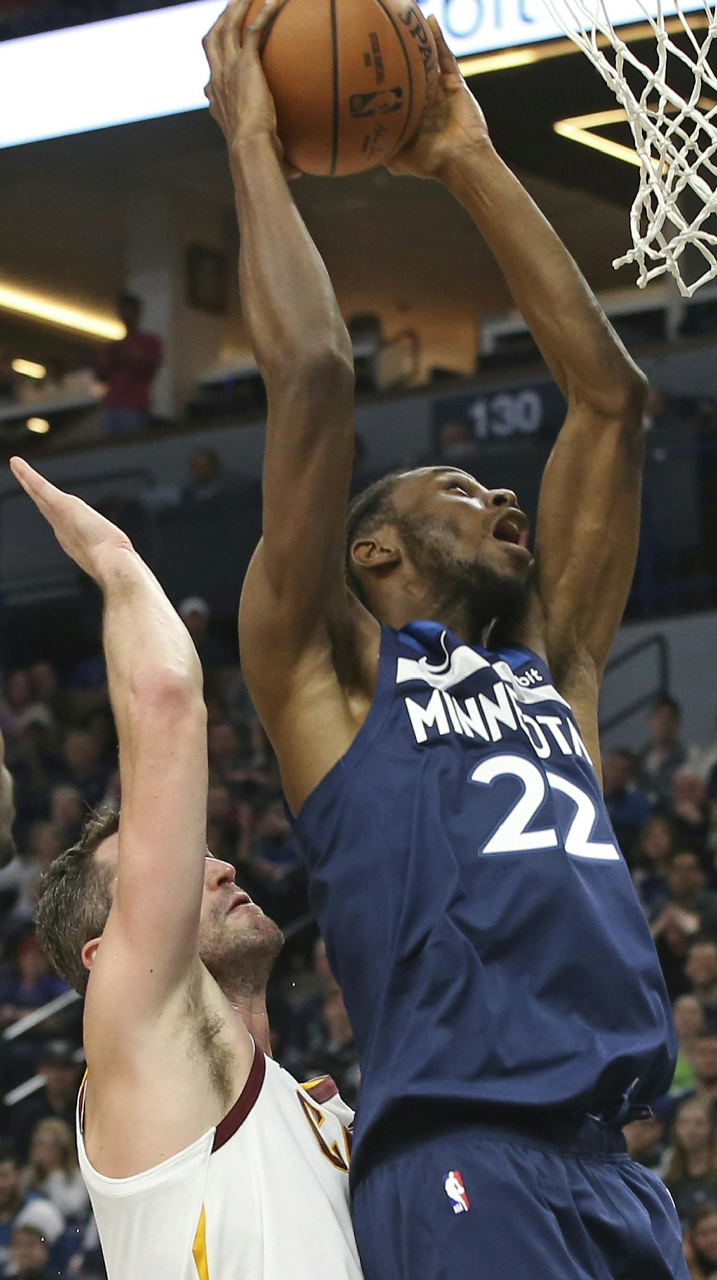 Minnesota Timberwolves' Andrew Wiggins, right, shoots as Cleveland Cavaliers' Kevin Love defends in the first half of an NBA basketball game Friday, Oct. 19, 2018, in Minneapolis. (AP Photo/Jim Mone) ORG XMIT: MIN2018101920323773