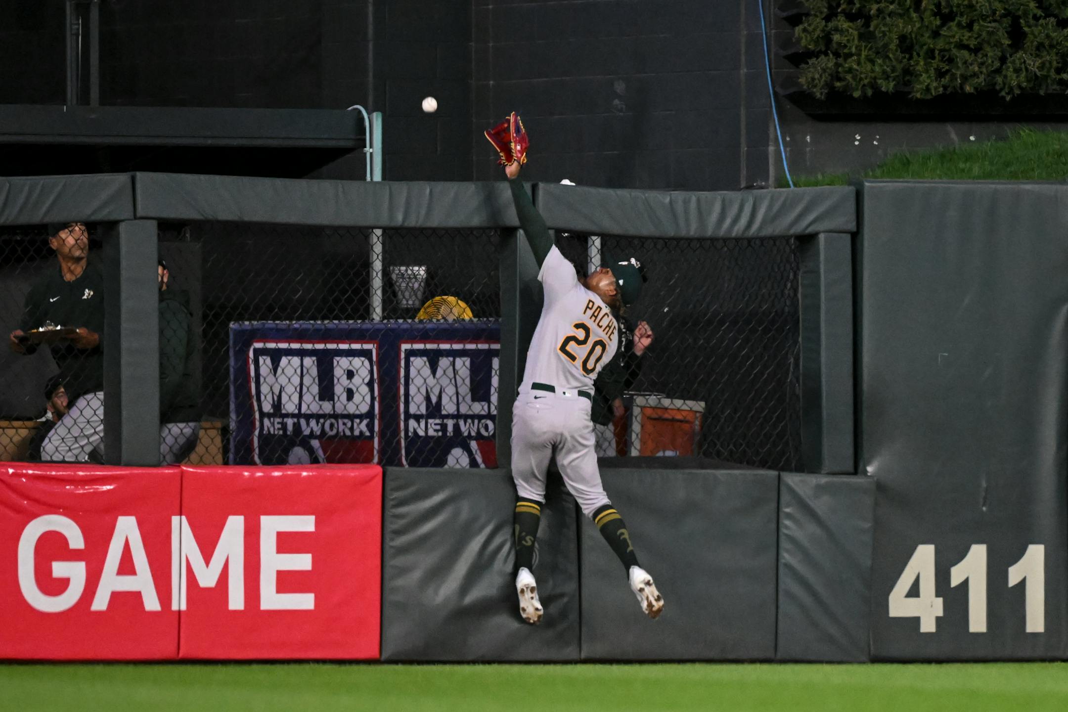 Minnesota Twins designated hitter Byron Buxton (25) hits a home run as Oakland Athletics center fielder Cristian Pache (20) attempts to make the catch against the Oakland Athletics in the bottom of the fifth inning.