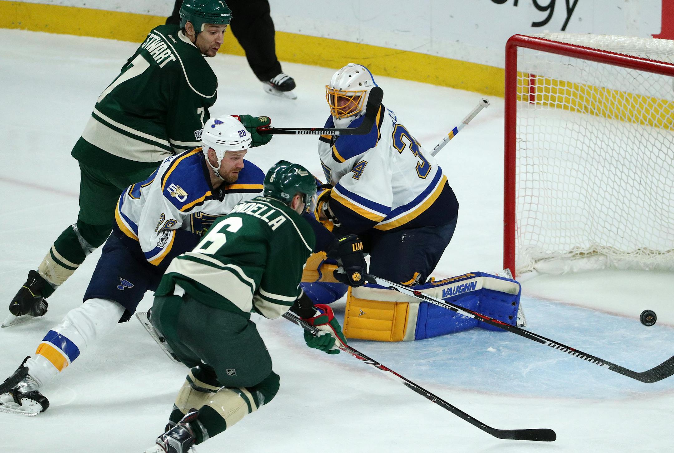 Minnesota Wild defenseman Marco Scandella (6) tried to get a shot off on St. Louis Blues goaltender Jake Allen (34) as St. Louis Blues center Kyle Brodziak (28) defended in the third period. ] ANTHONY SOUFFLE ï anthony.souffle@startribune.com Game action from an NHL playoff game 2 between the Minnesota Wild and the St. Louis Blues Friday, April 14, 2017 at the Xcel Energy Center in St. Paul, Minn.