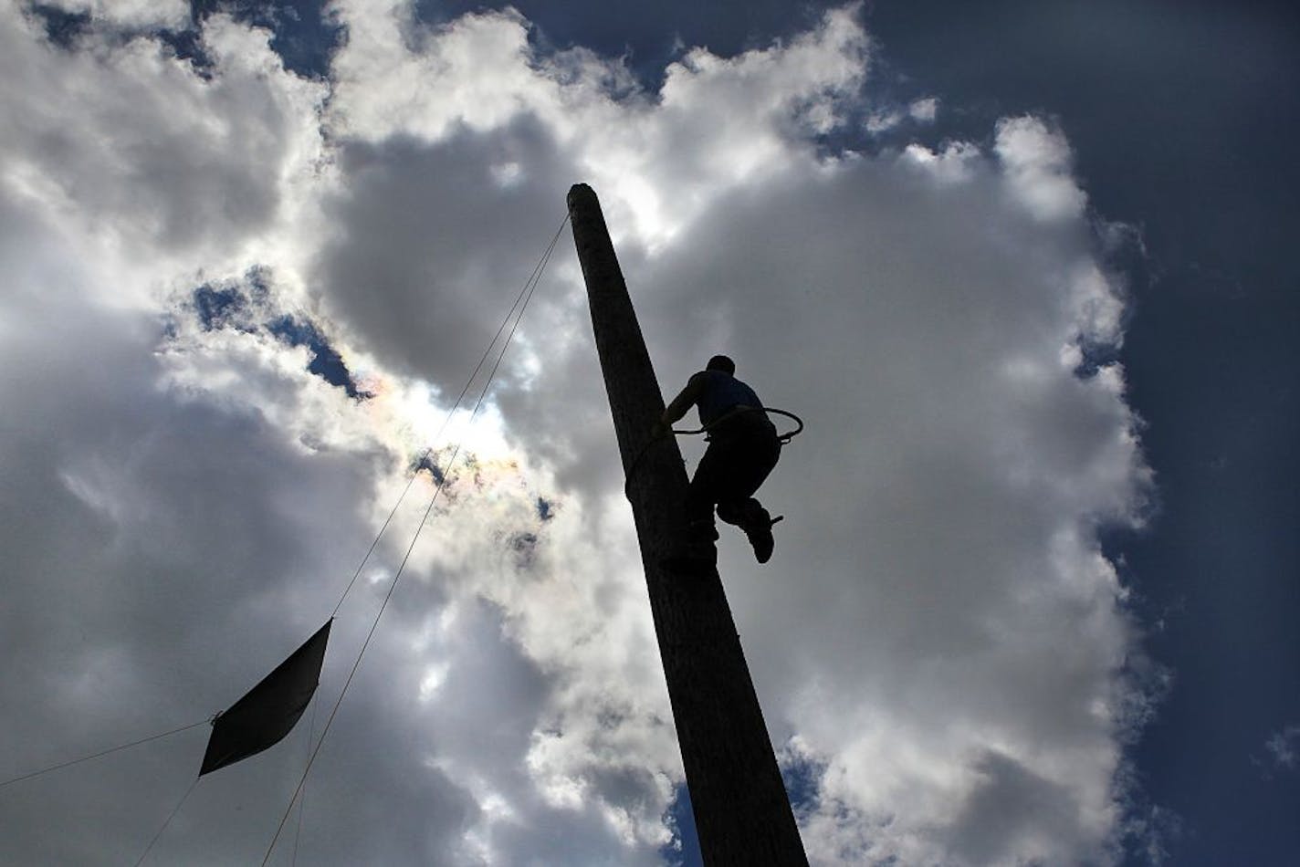 Lumberjack Geno Cummings, Frederic, WI., raced to the top of a tall, wooden pole during a climbing demonstration with another lumberjack, Mike Sharp, Glens Falls, N.Y. (not pictured).