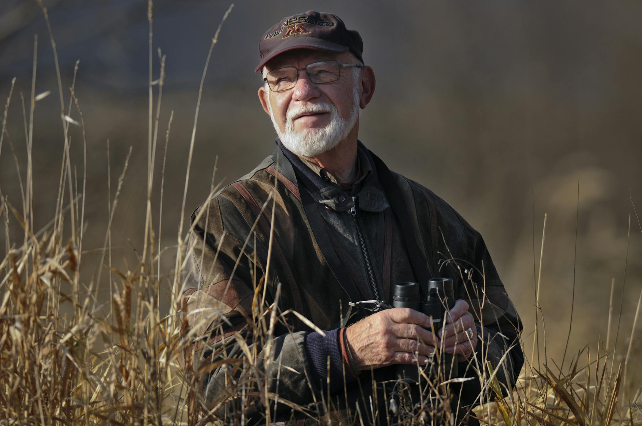 Bob Janssen has been trudging into Painter's Marsh near Lake Minnetonka to search for birds. Some of the birds he's seen - sandhill cranes, black terns and red-shouldered hawks - are rarely spotted in the greater metro area. Janssen is chronicling the birds to help the Minnehaha Creek Watershed District with a habitat improvement project. ] Richard.Sennott@startribune.com Richard Sennott/Star Tribune. Minnetrista Minn.Tuesday 11/23/11) ** Bob Janssen (cq)