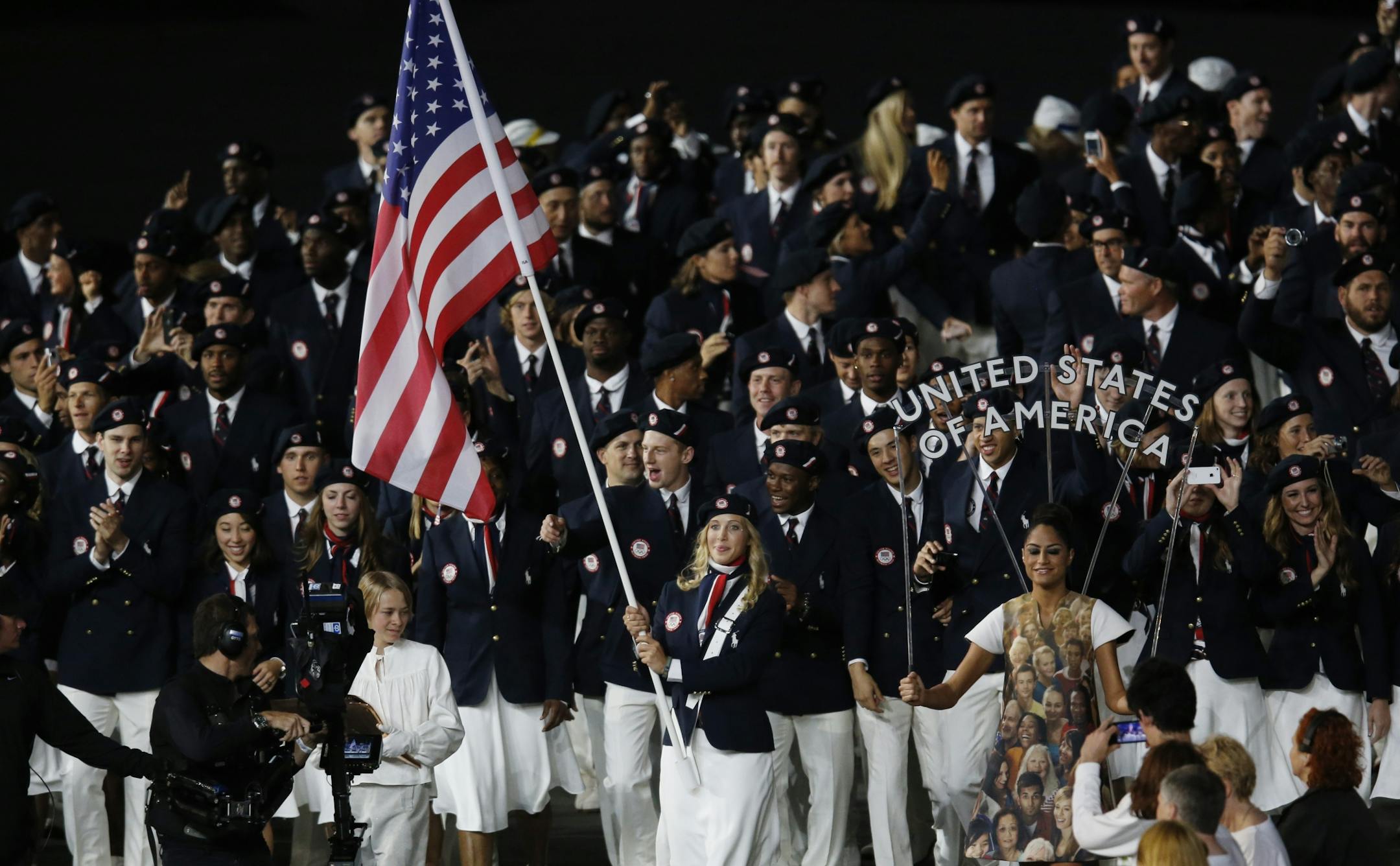 The Opening Ceremony of the London Summer Olympic Games. Mariel Zagunis lead team USA with the American flag in the first Summer Games in which the U.S. women outnumber the men. Zaginus is two-time Olympic gold medalist in the individual sabre, one of the three events in fencing, now has the country's attention and rightfully so.