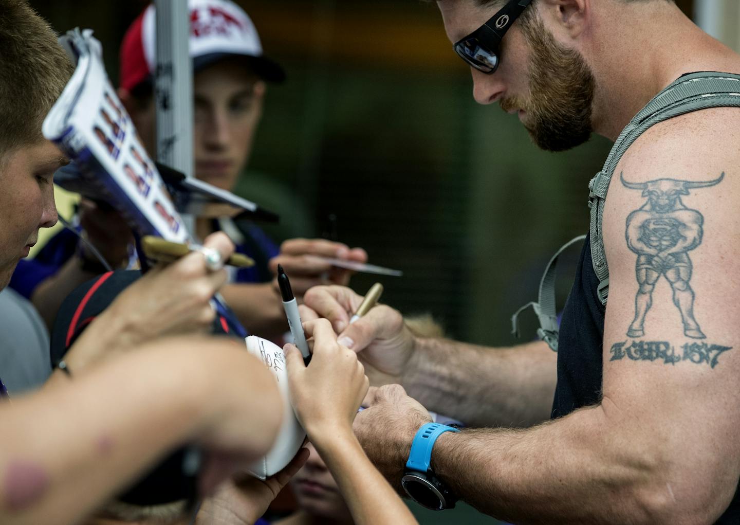 Vikings defensive lineman Brian Robison signed autographs for fans at the start of training camp.