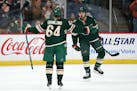 The Wild's Matt Dumba celebrated with teammate Mikael Granlund after Granlund scored the first goal of the game in the first period against the Nashvi