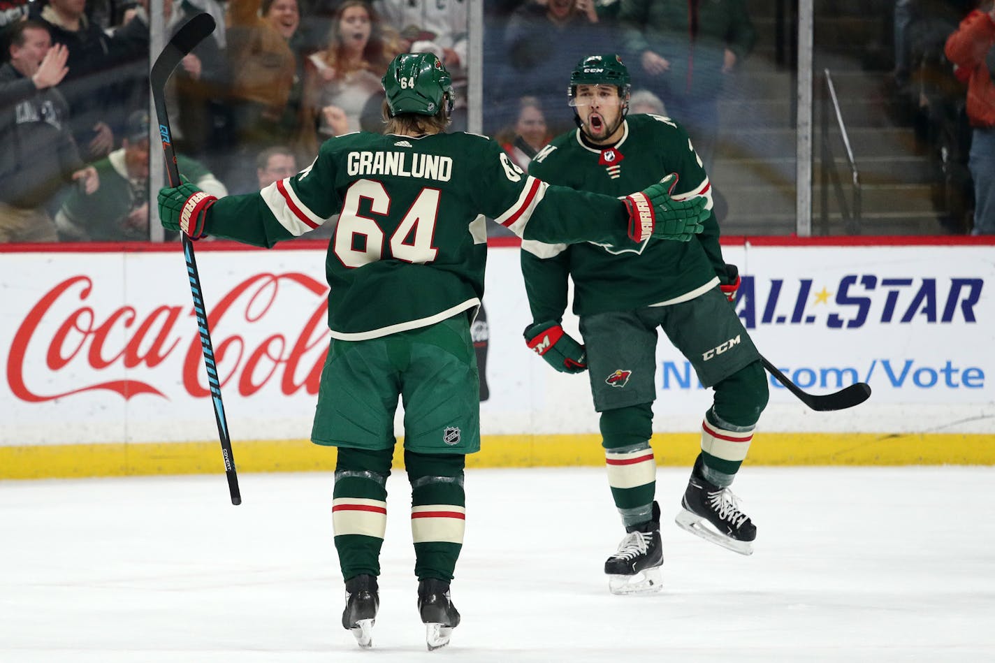 The Wild's Matt Dumba celebrated with teammate Mikael Granlund after Granlund scored the first goal of the game in the first period against the Nashville Predators on Friday