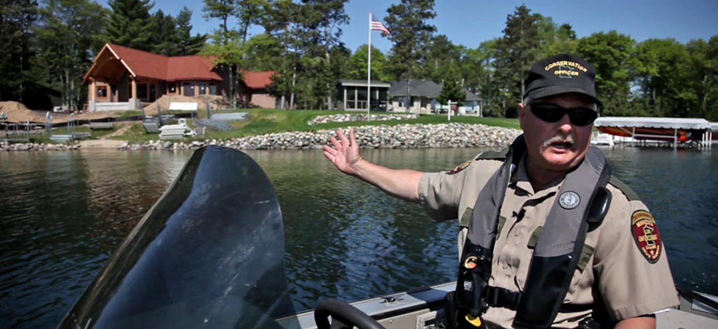 DNR conservation officers' duties are many and varied, including patrolling state lakes looking for lakeshore and dock violations. ORG XMIT: MIN2017022813551844