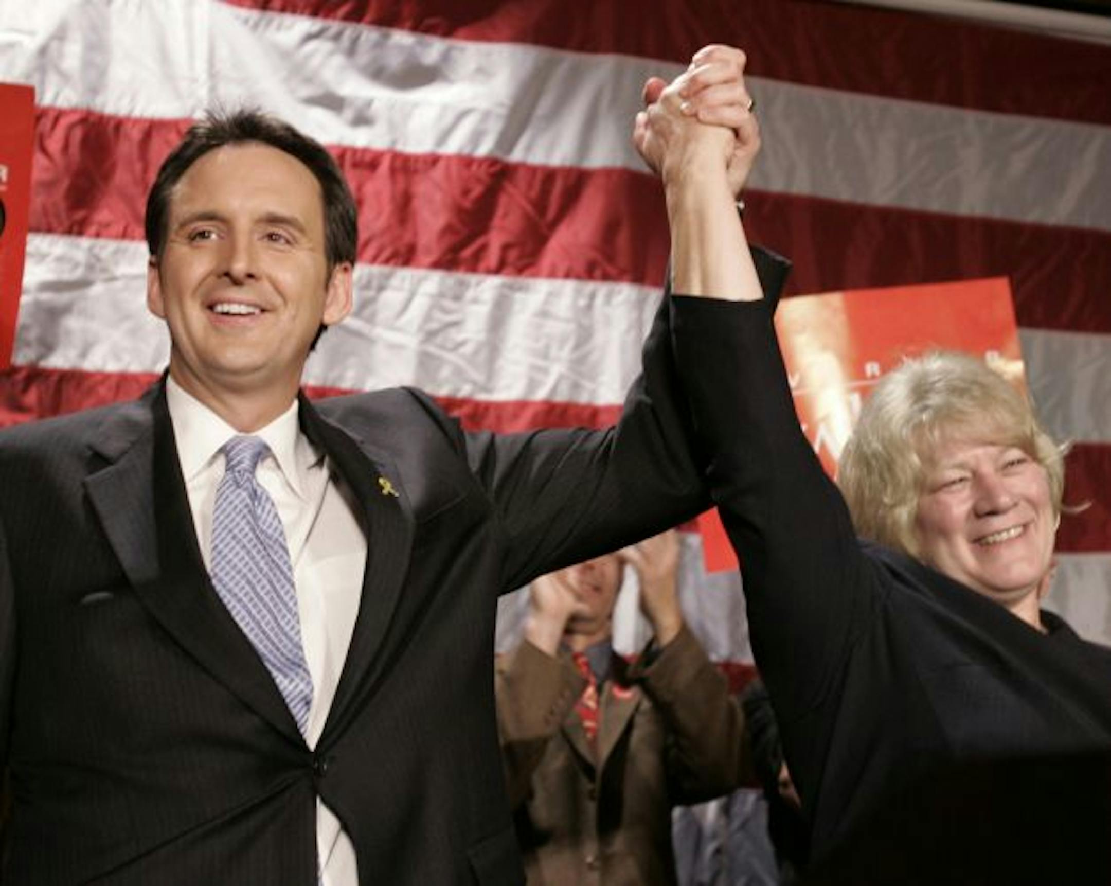 Republican Gov. Tim Pawlenty and Lt. Gov. Carol Molnau celebrate at election night headquarters early Wednesday morning, Nov. 8, 2006, after Pawlenty defeated Democrat Mike Hatch in a tight race to win re-election.