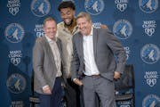 Karl Anthony Towns was all smiles alongside Genreral Manager Tim Connelly, left, and head coach Chris Finch, right, after his contract extension in 20