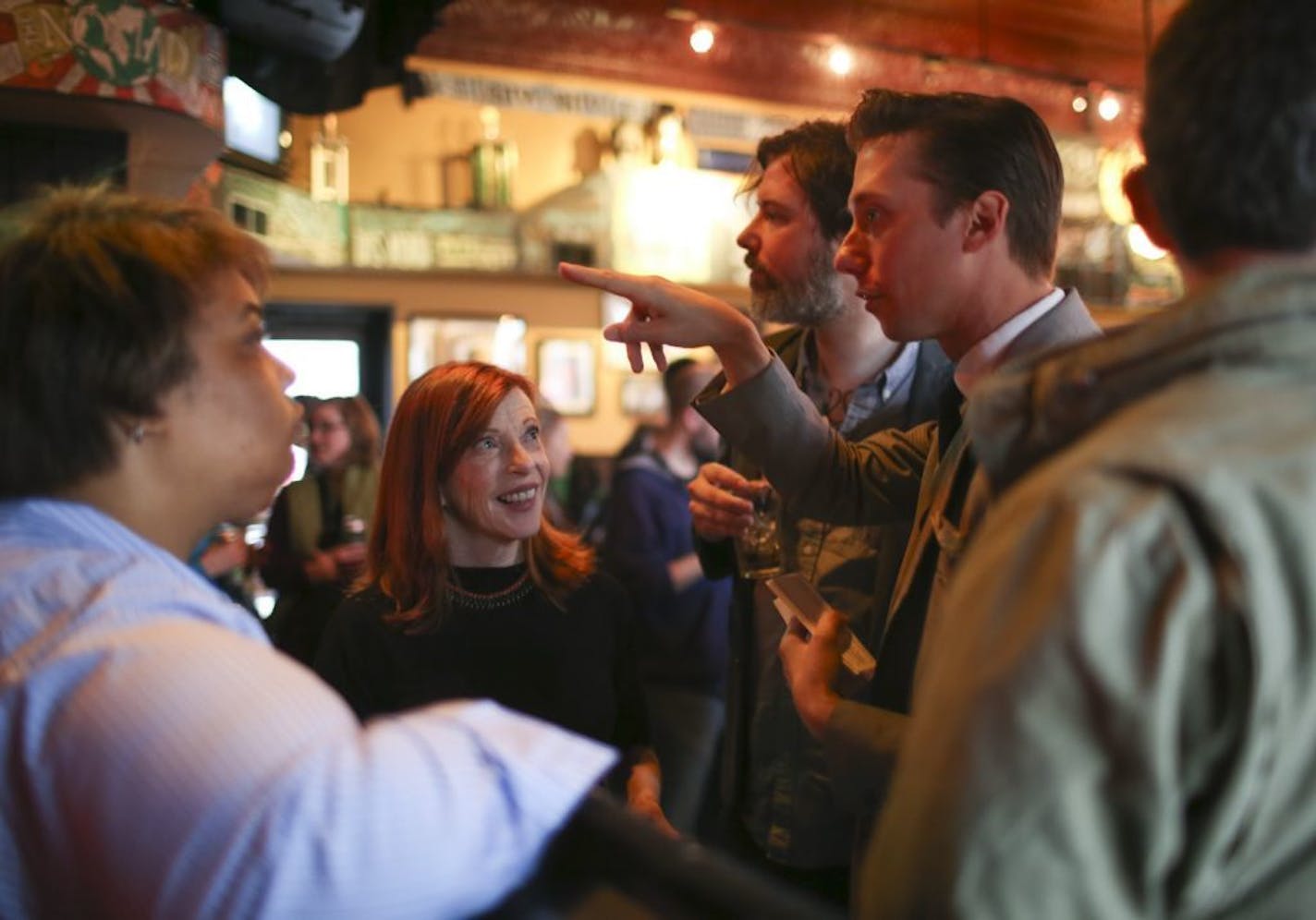 Literary Death Match creator and emcee Adrian Todd Zuniga, pointing, spoke with participants Roxane Gay, judge Susan Orlean, participant Mark Doten, and judge Benjamin Percy, from left, before the event Wednesday night at Nomad World Pub.