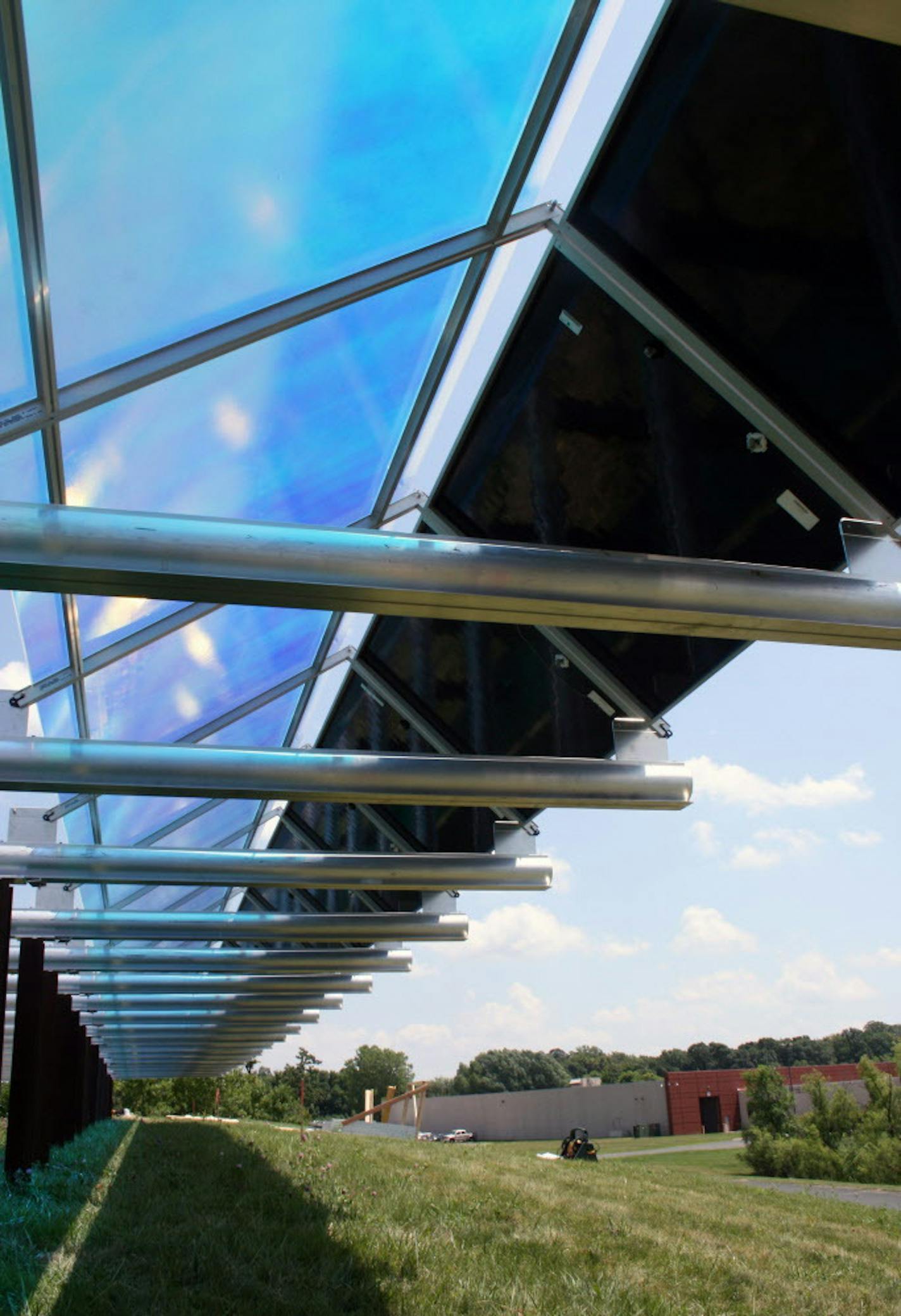 This July 2013 photo provided by the Wright Hennepin Cooperative Electric Association shows part of the first community solar array in Minnesota, in Rockford, Minn. A sweeping state energy law approved this spring demands that utilities generate or procure 1.5 percent of their power from solar sources by 2020 &#xf3; a big step up from where the state is now. Under that law, Xcel Energy Inc. has until Monday, Sept. 30, 2013, to tell how the giant electricity provider would like to manage the roll