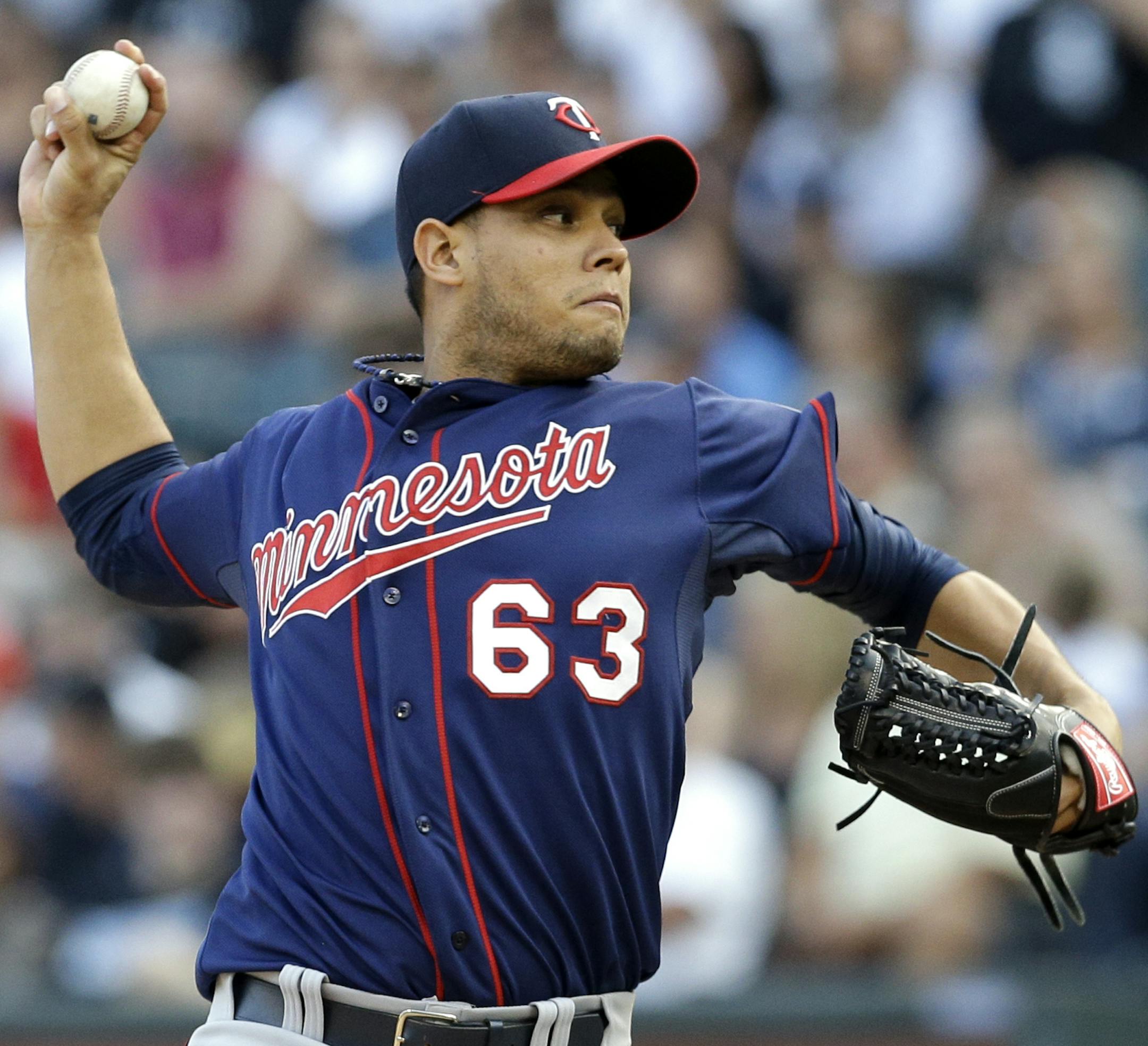 Minnesota Twins starter Yohan Pino throws against the Chicago White Sox during the first inning of a baseball game in Chicago, Saturday, Aug. 2, 2014. (AP Photo/Nam Y. Huh)